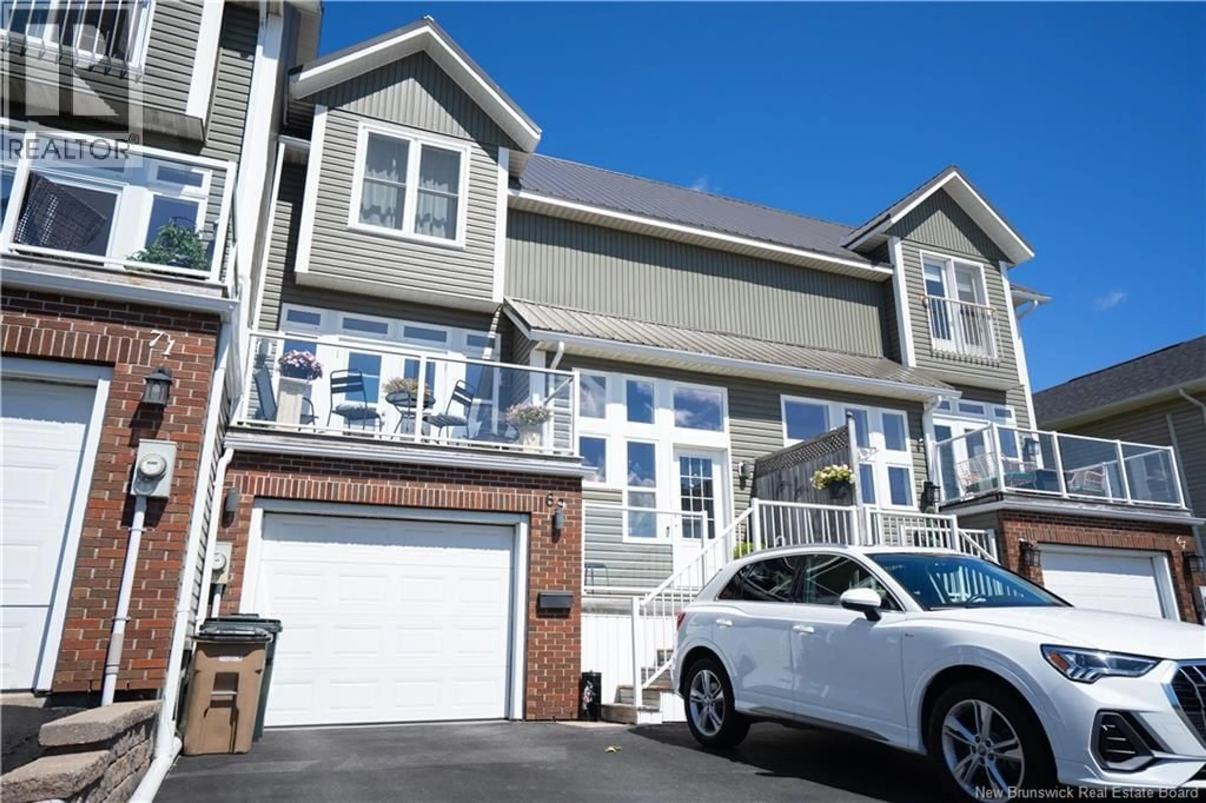 Home with vinyl exterior material, street for 69 MOORE STREET, Saint John New Brunswick E2K5N1