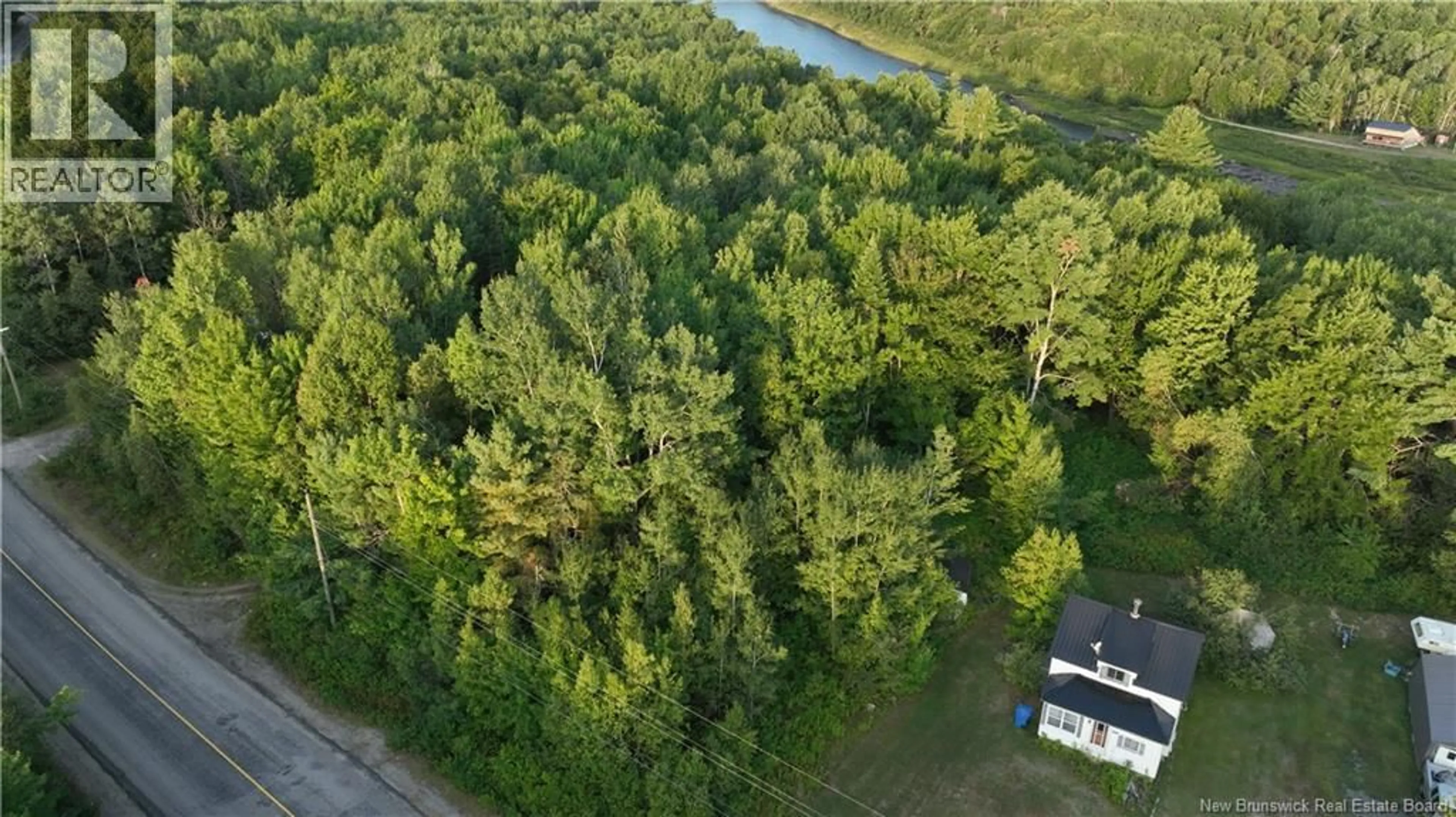 A pic from outside/outdoor area/front of a property/back of a property/a pic from drone, forest/trees view for 1455 HWY 118, White Rapids New Brunswick E9B1A6