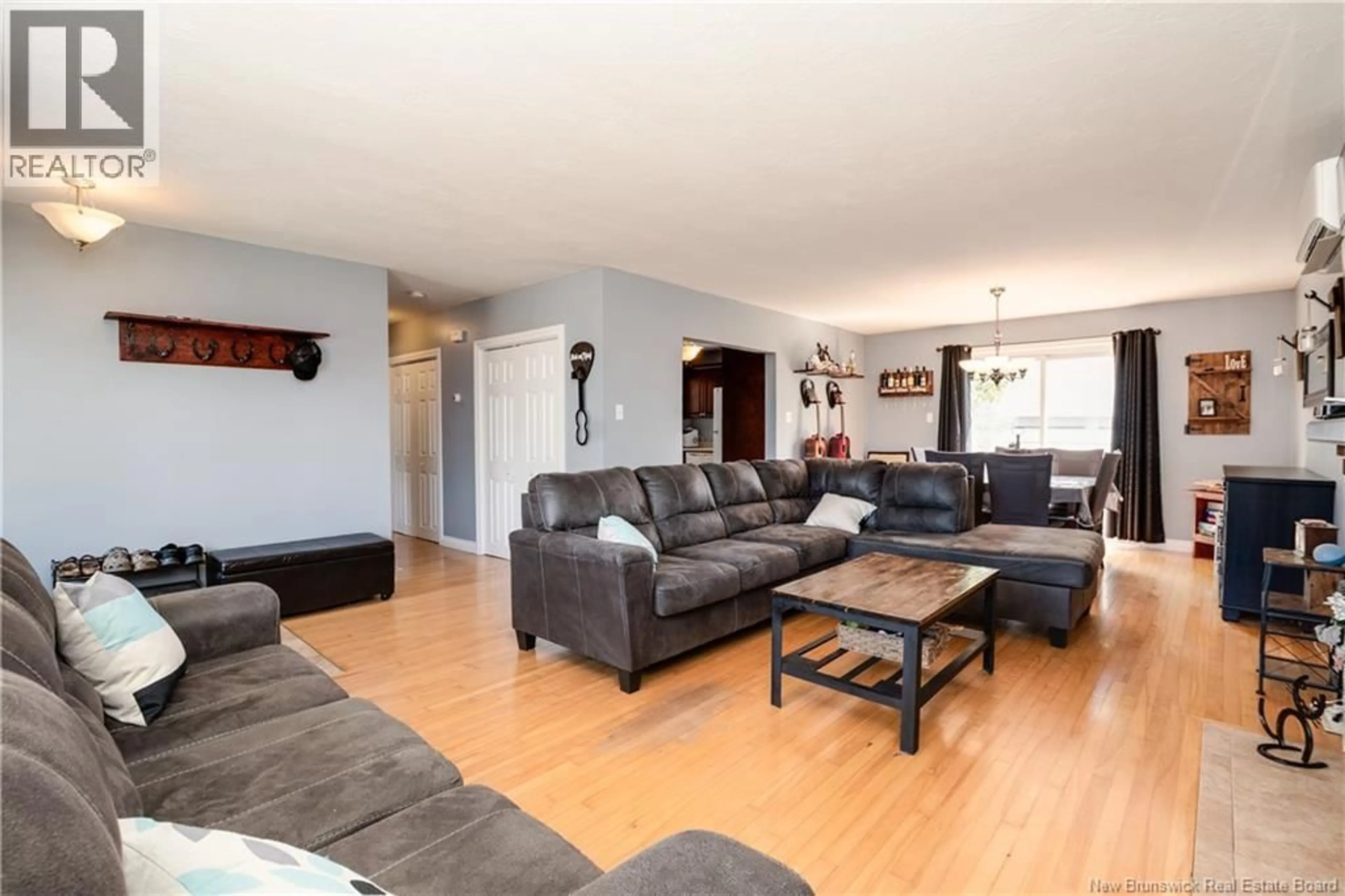 Living room with furniture, wood/laminate floor for 8 COPP STREET, Dieppe New Brunswick E1A2H1