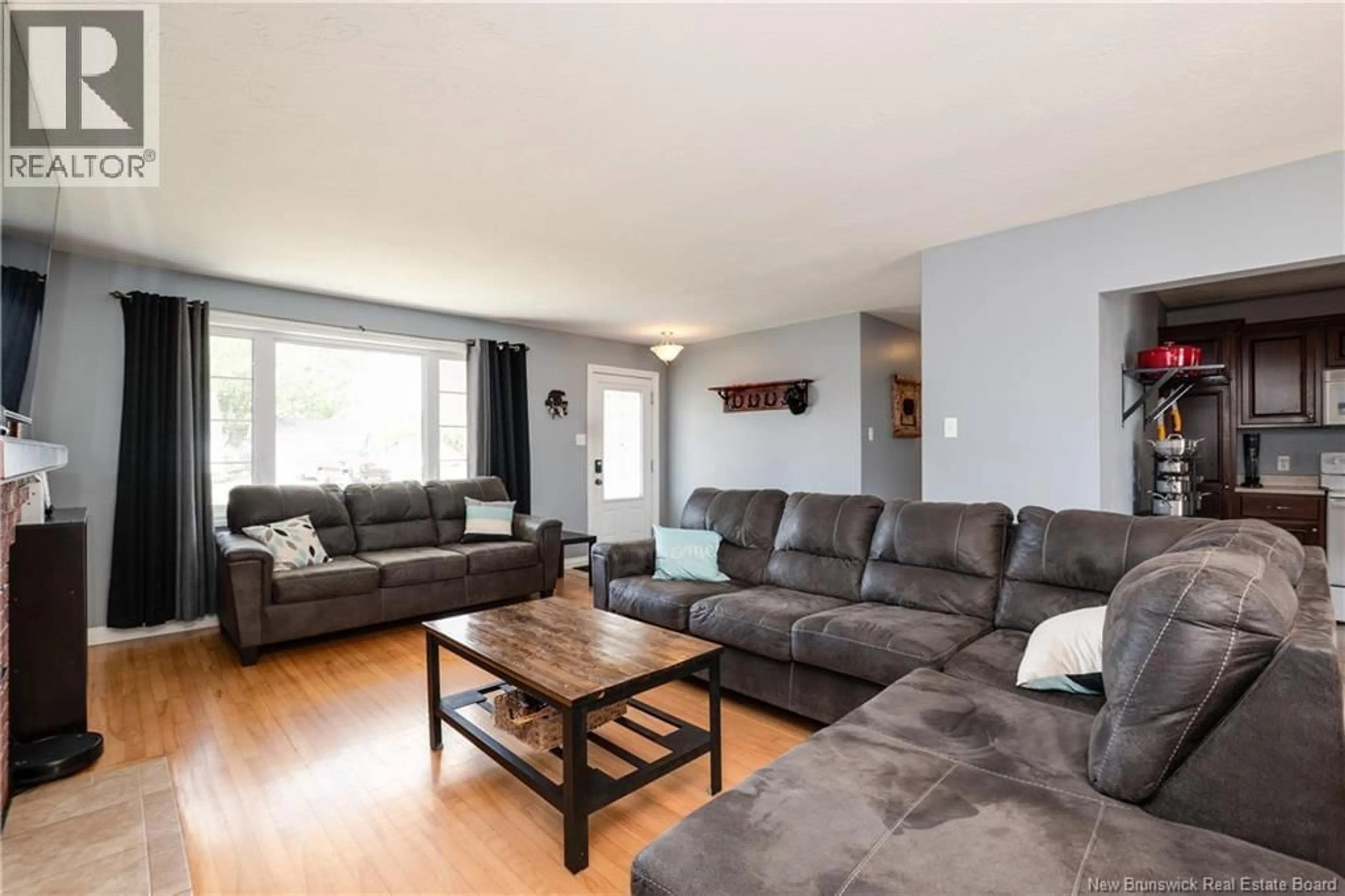Living room with furniture, wood/laminate floor for 8 COPP STREET, Dieppe New Brunswick E1A2H1