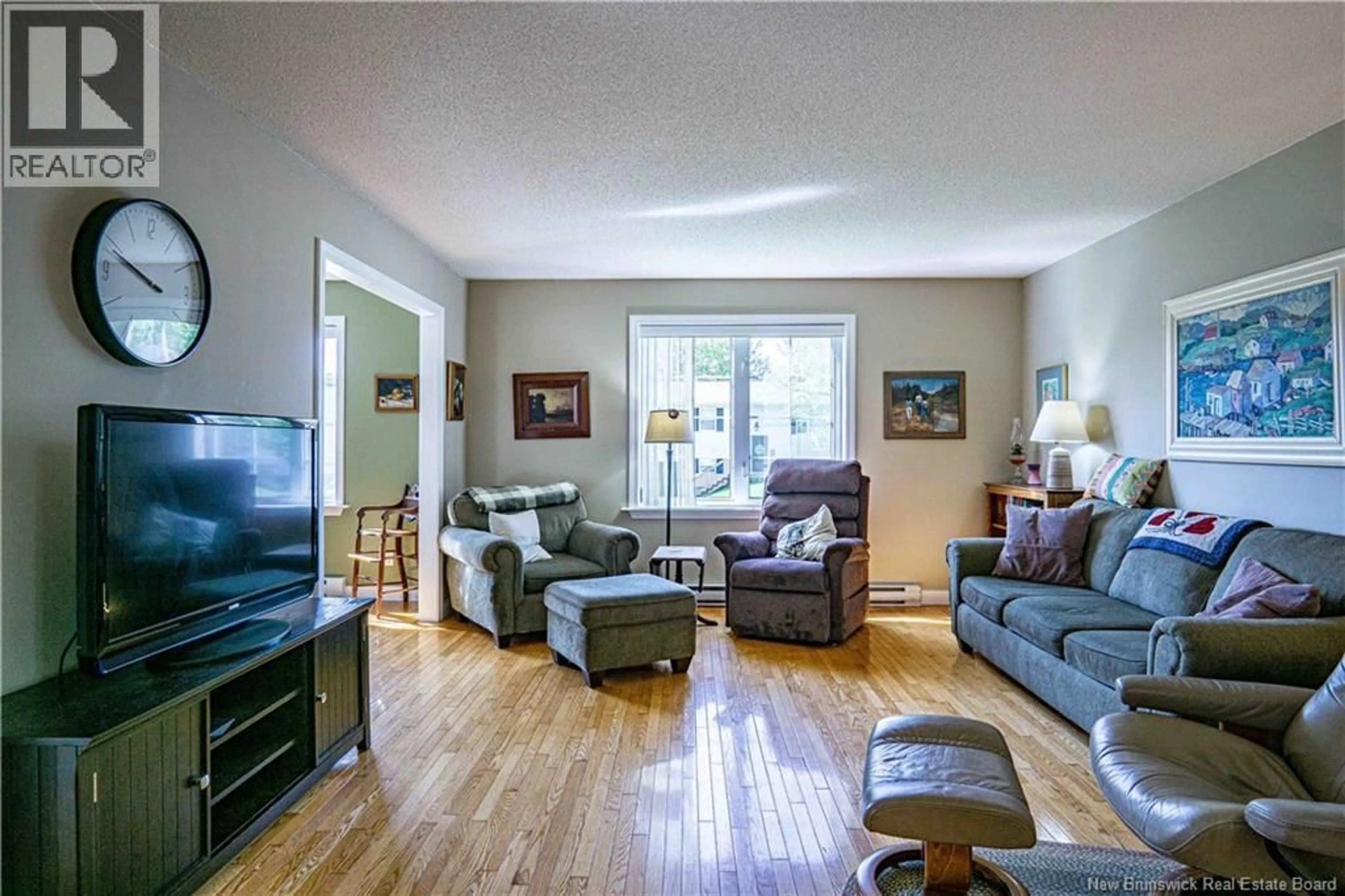 Living room with furniture, wood/laminate floor for 8 LANSDOWN STREET, Oromocto New Brunswick E2V4P3