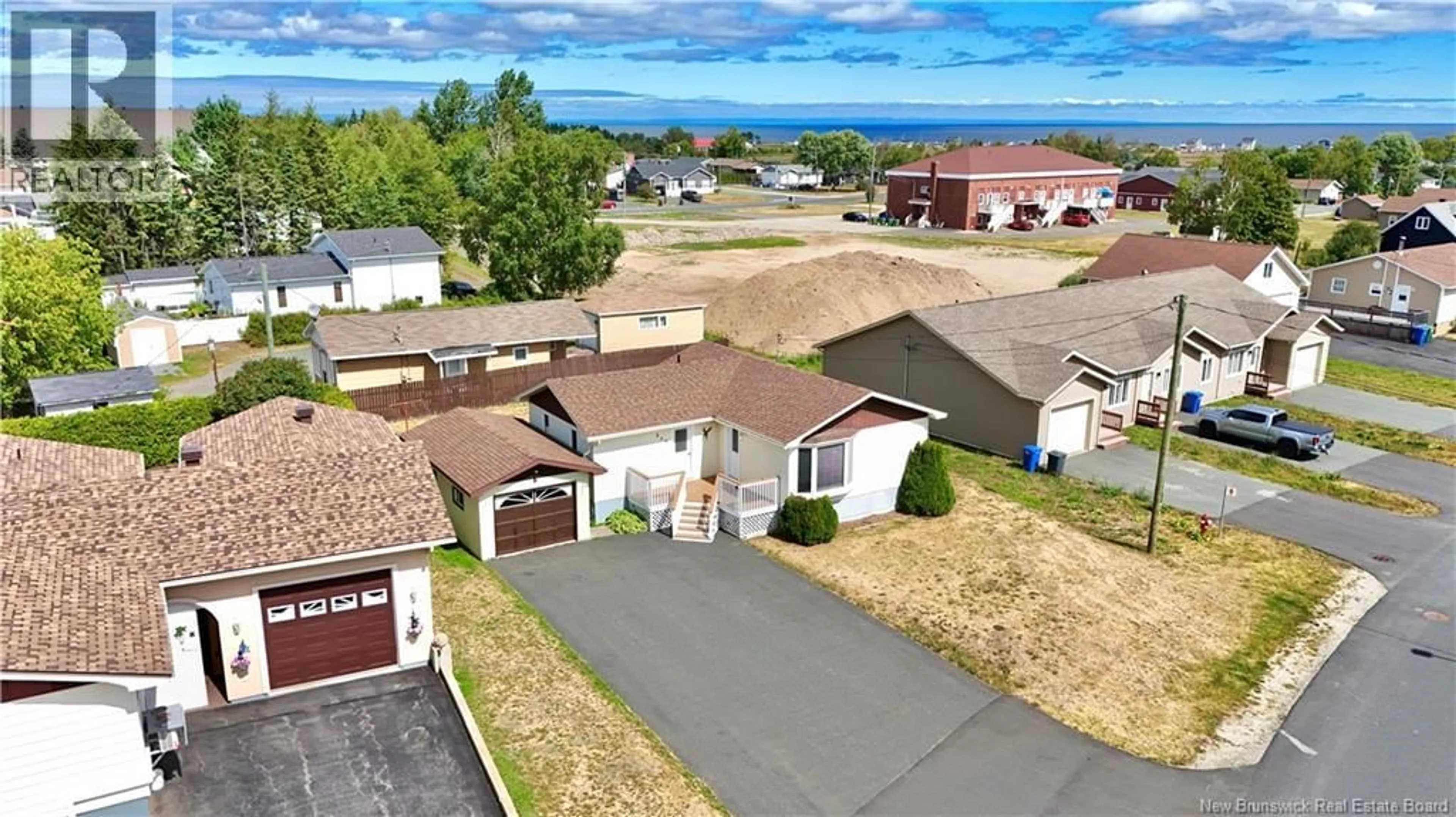 A pic from outside/outdoor area/front of a property/back of a property/a pic from drone, unknown for 250 GODIN, Beresford New Brunswick E8K1T7
