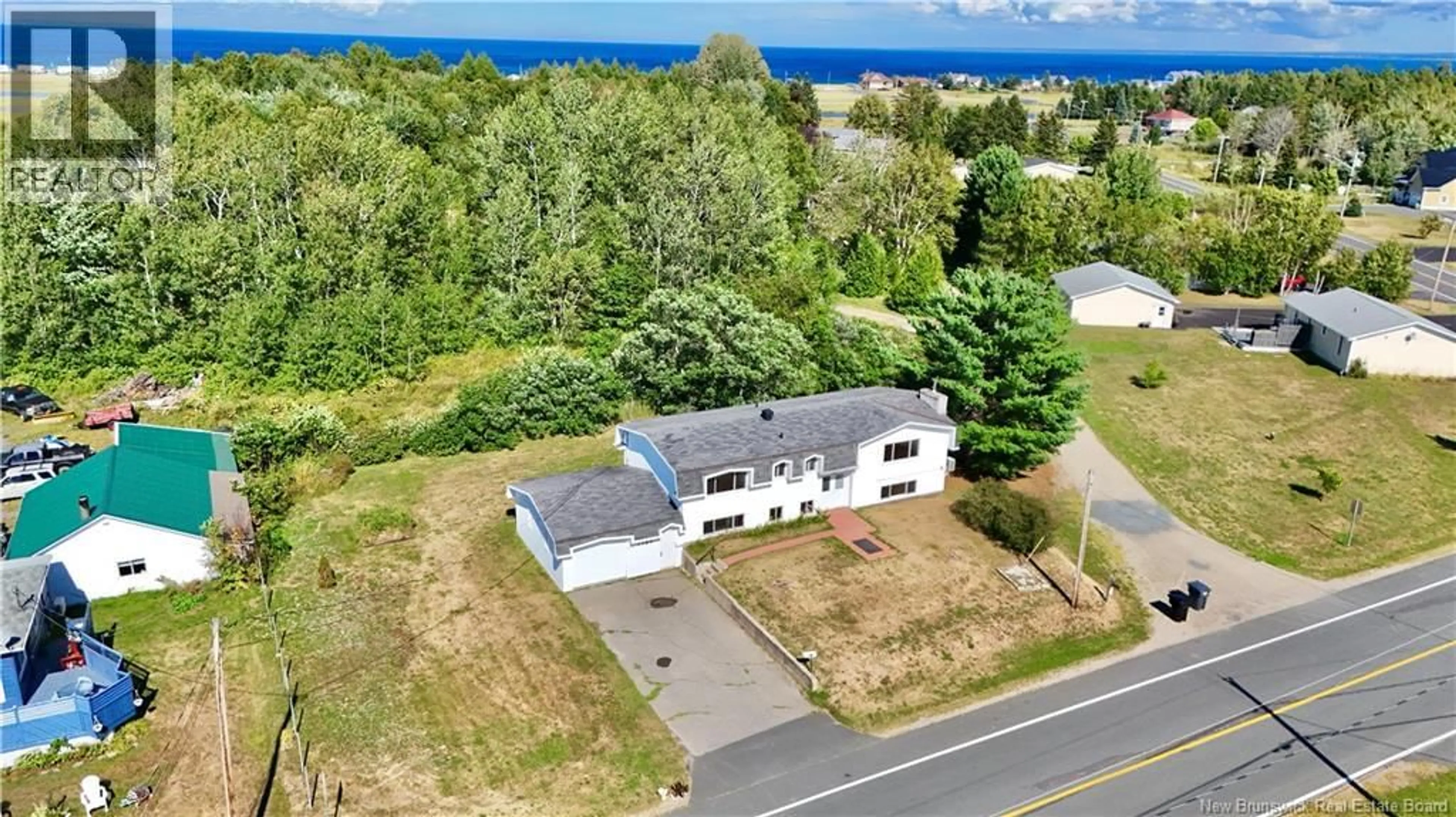 A pic from outside/outdoor area/front of a property/back of a property/a pic from drone, water/lake/river/ocean view for 1185 BRYAR, Beresford New Brunswick E8K1B2