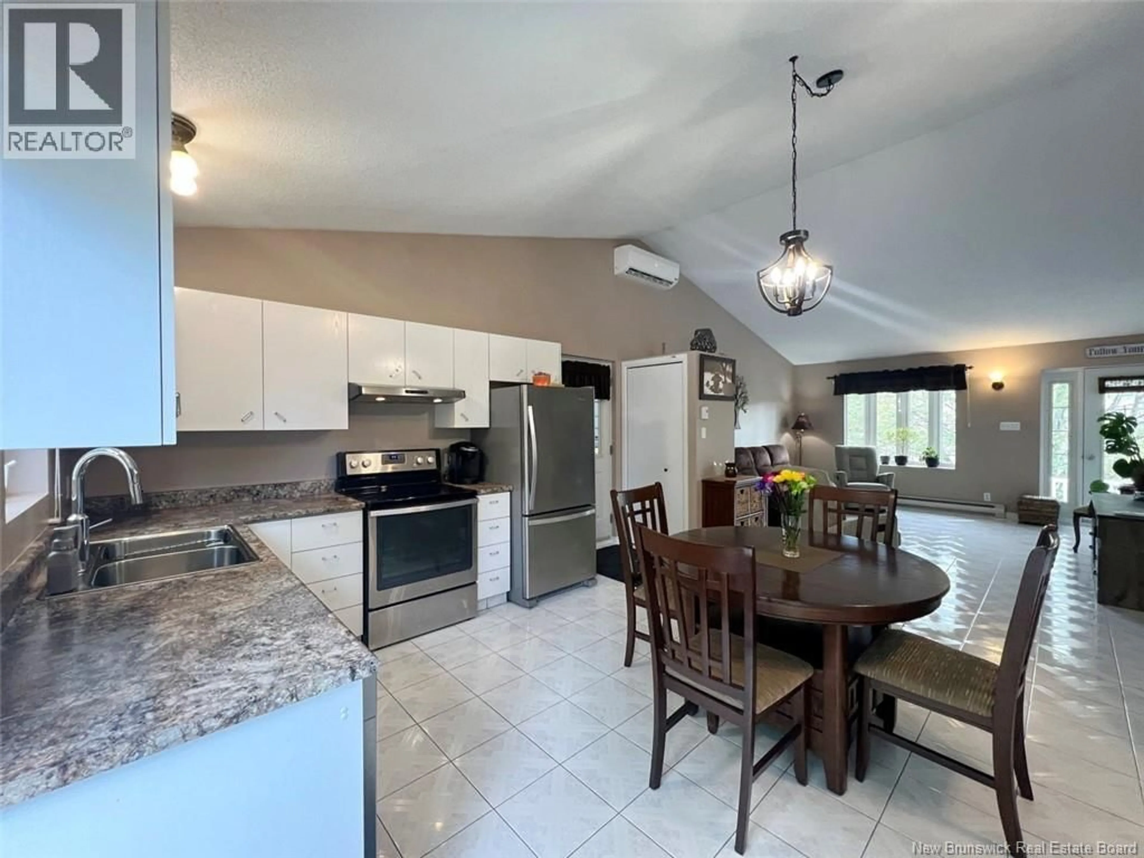 Open concept kitchen, ceramic/tile floor for 30 DES GOUVERNEURS STREET, Edmundston New Brunswick E3V4H5