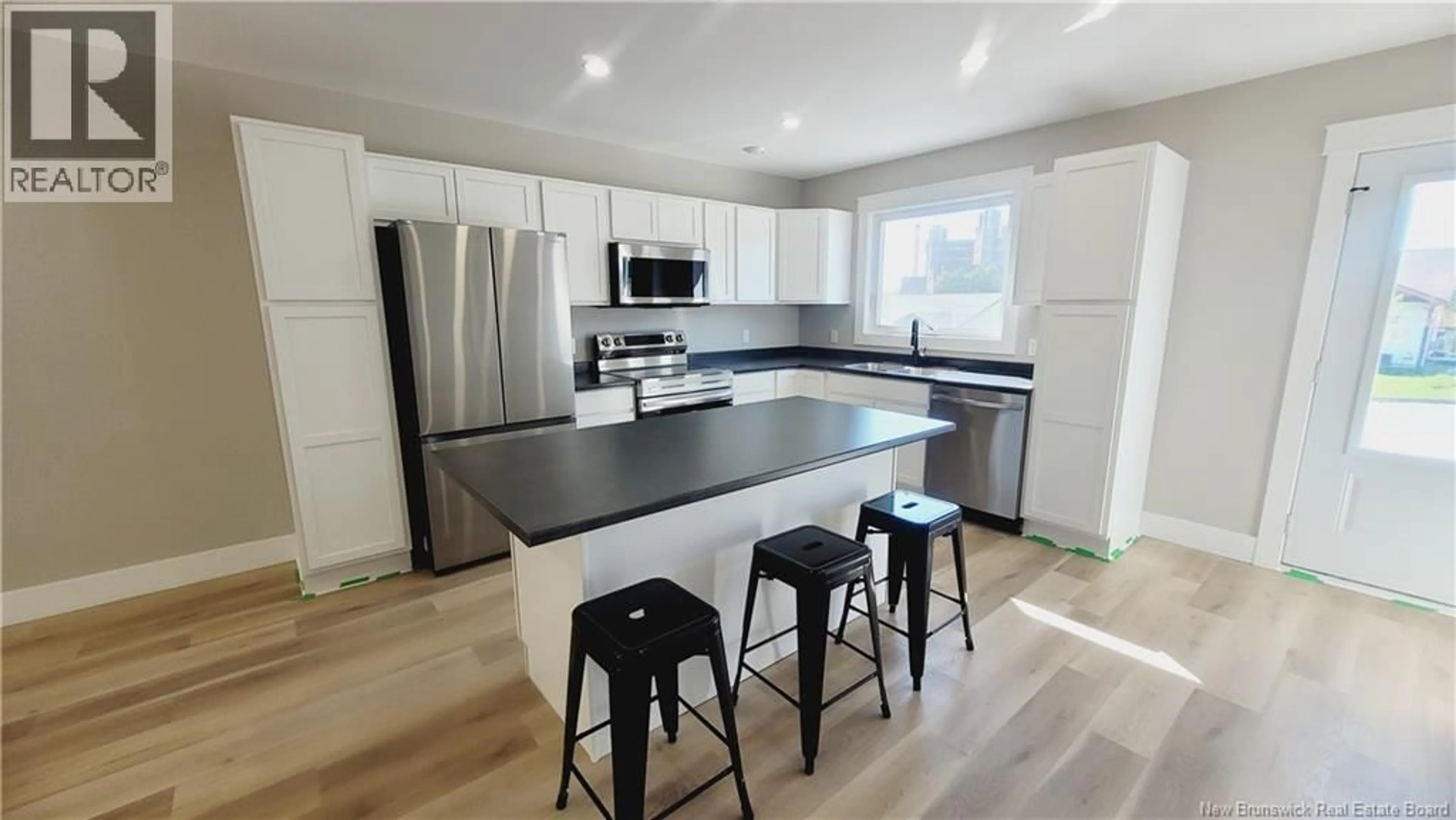 Open concept kitchen, wood/laminate floor for 171 ARLINGTON CRESCENT, Saint John New Brunswick E2K0G4