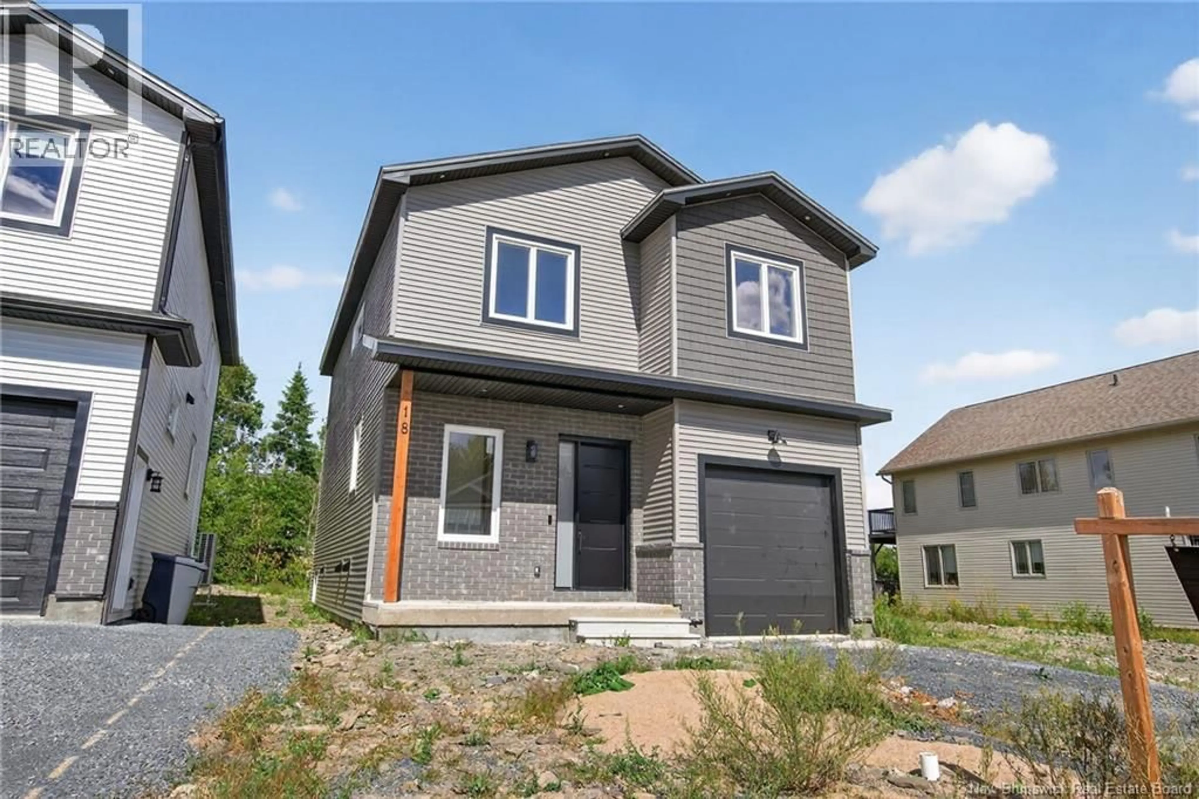 Home with vinyl exterior material, street for 18 WEAVERS WAY, Fredericton New Brunswick E3A3P8