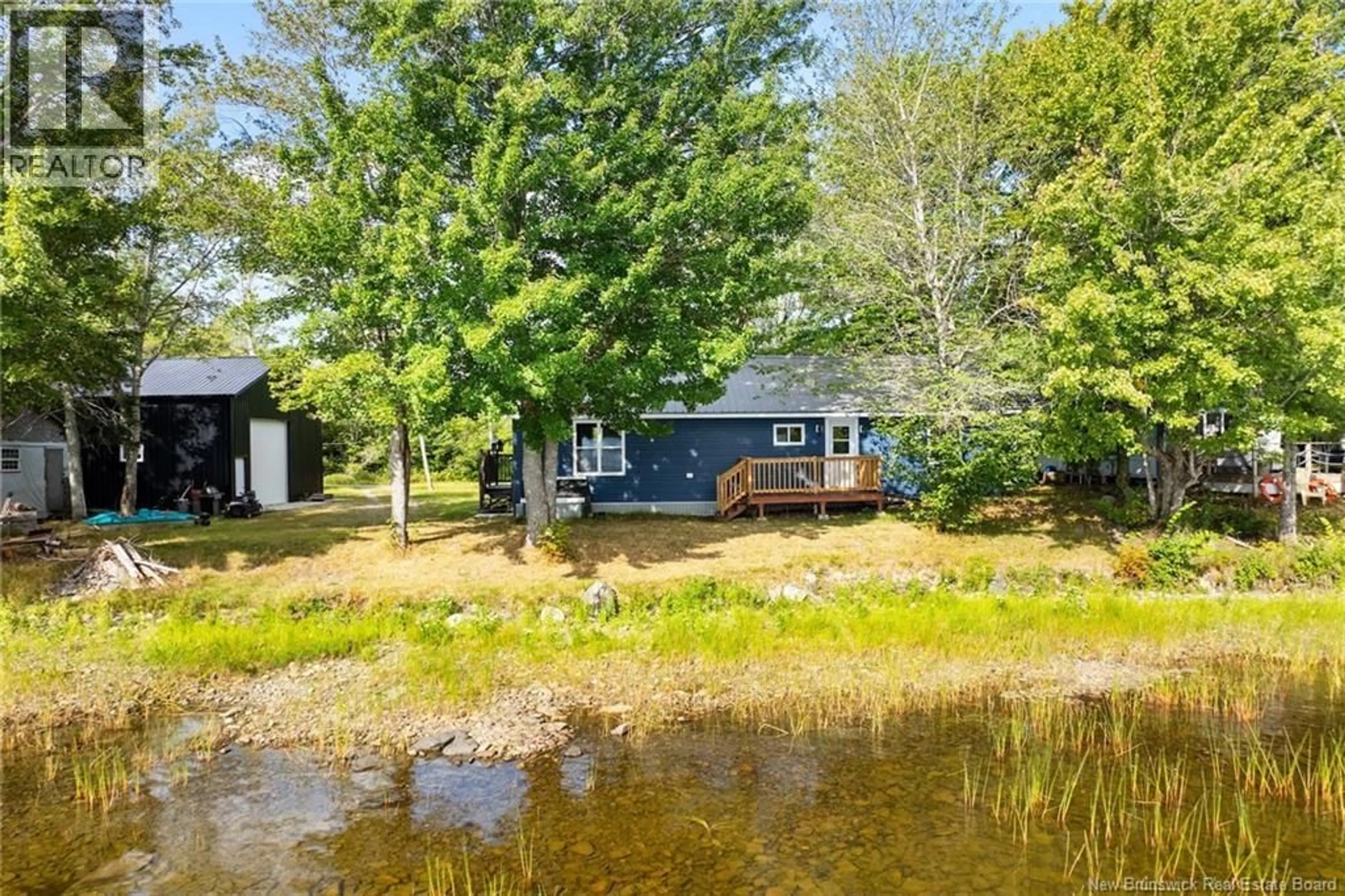 A pic from outside/outdoor area/front of a property/back of a property/a pic from drone, water/lake/river/ocean view for 52 LOON LANE, Lake George New Brunswick E6K3J1