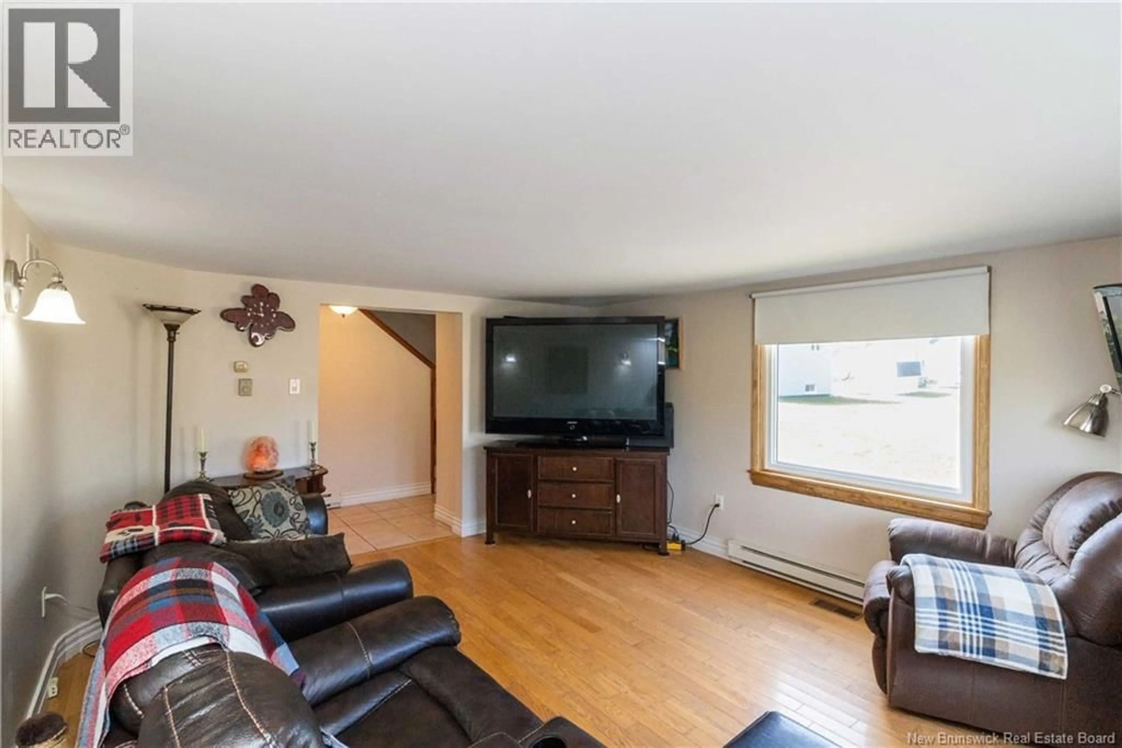 Living room with furniture, wood/laminate floor for 165 JACQUES STREET, Memramcook New Brunswick E4K2H7