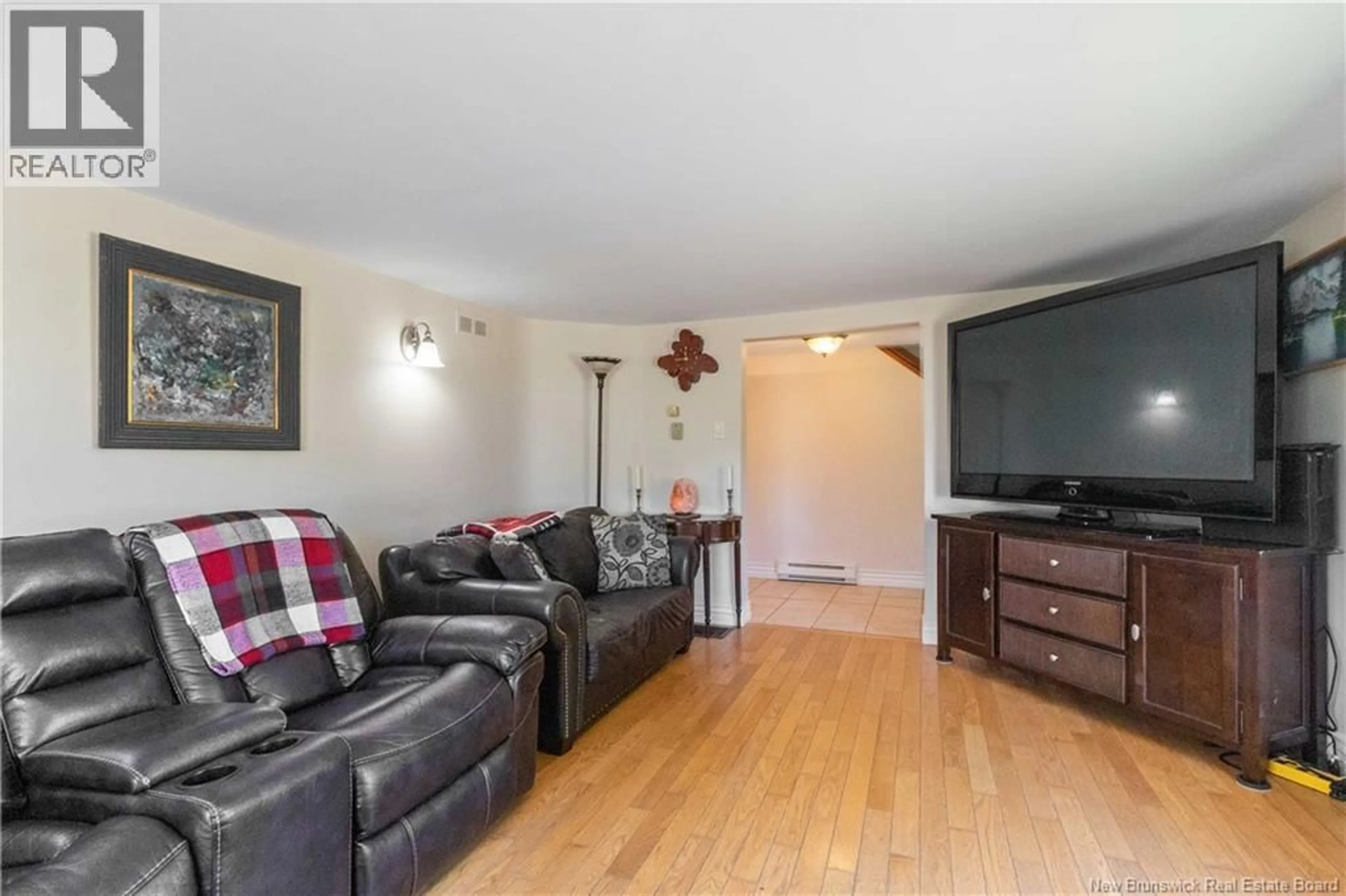 Living room with furniture, wood/laminate floor for 165 JACQUES STREET, Memramcook New Brunswick E4K2H7