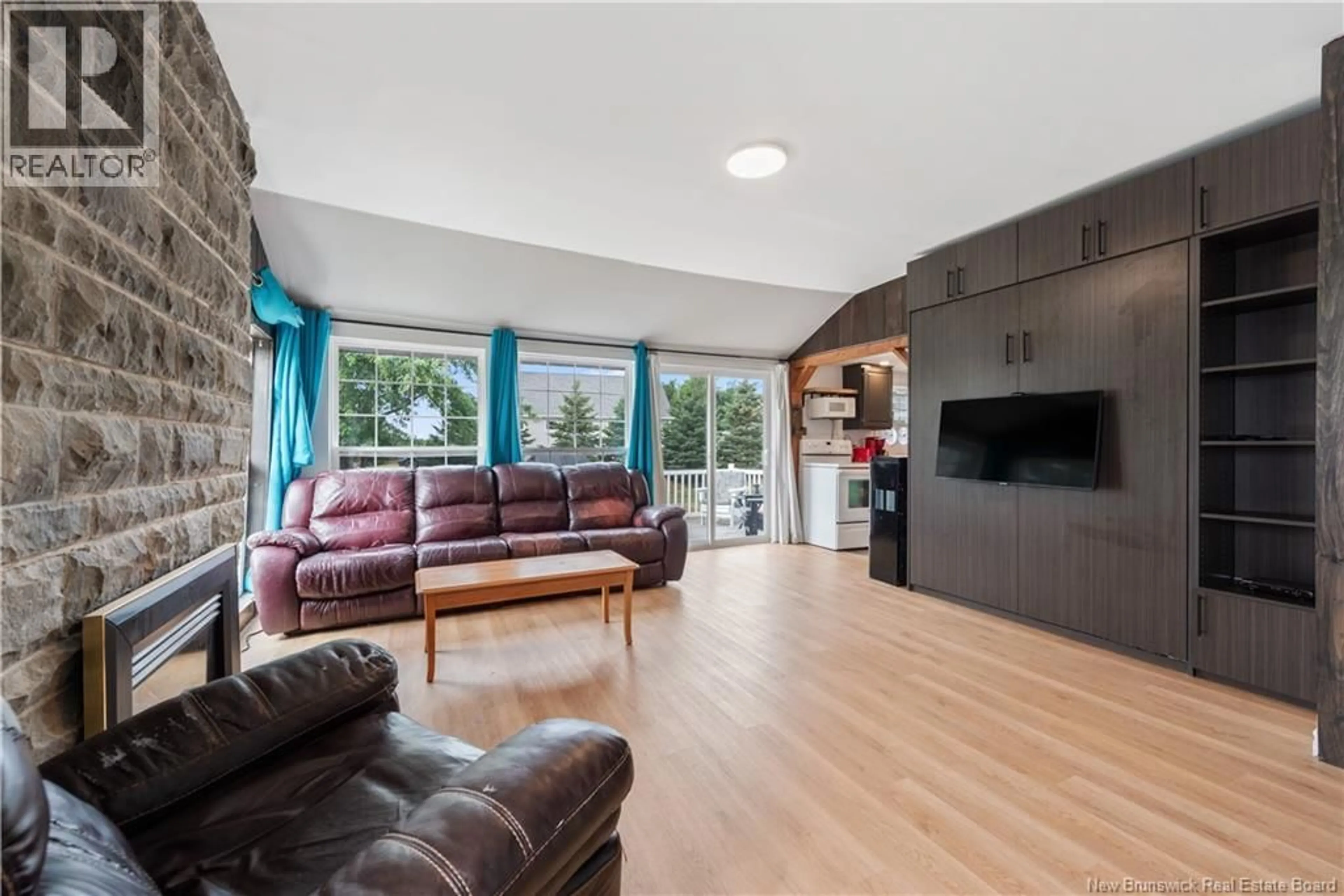 Living room with furniture, wood/laminate floor for 23 SUNSET LANE, Shediac New Brunswick E4P5H2