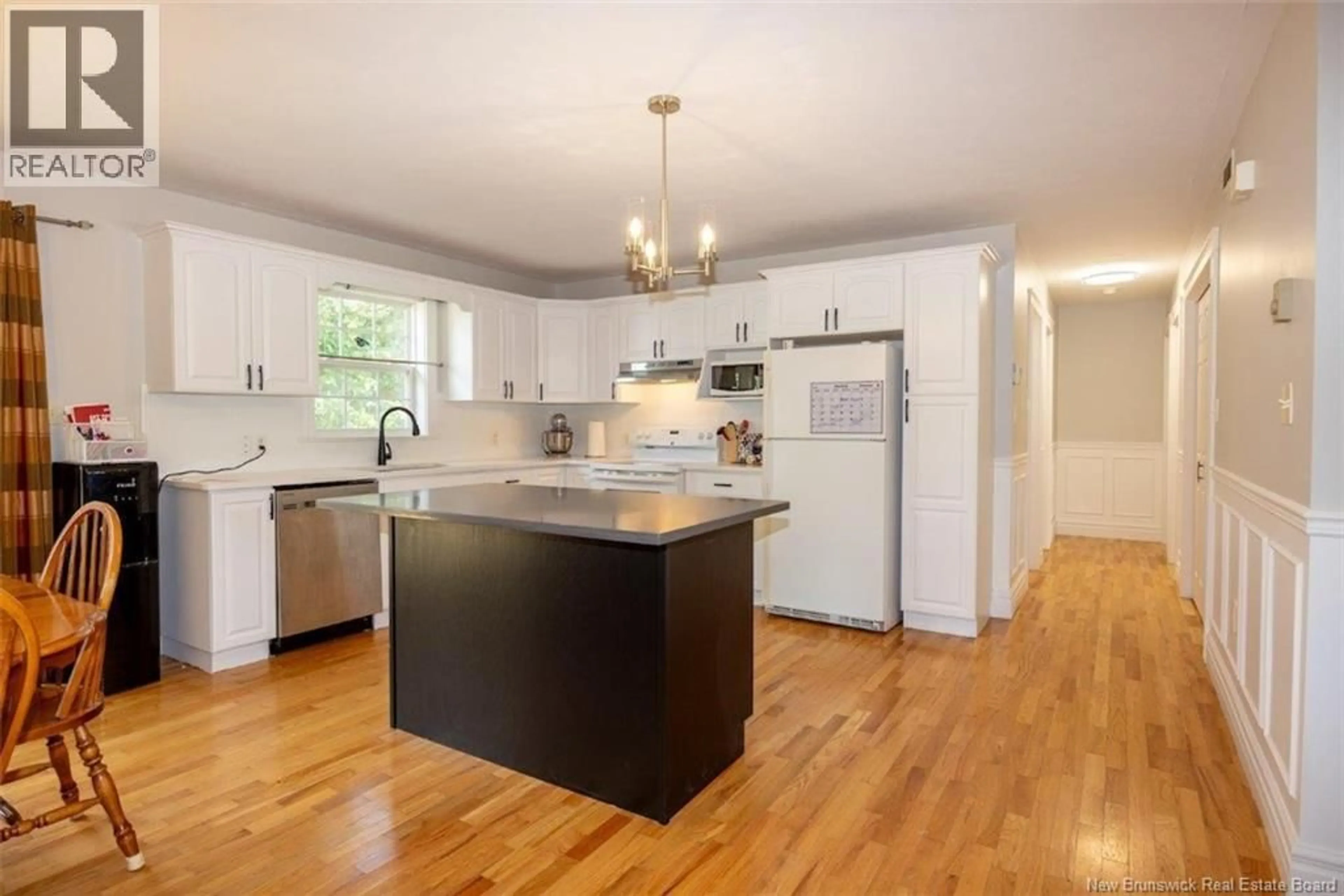 Open concept kitchen, wood/laminate floor for 4 HAYWARD COURT, Fredericton New Brunswick E3A0A4