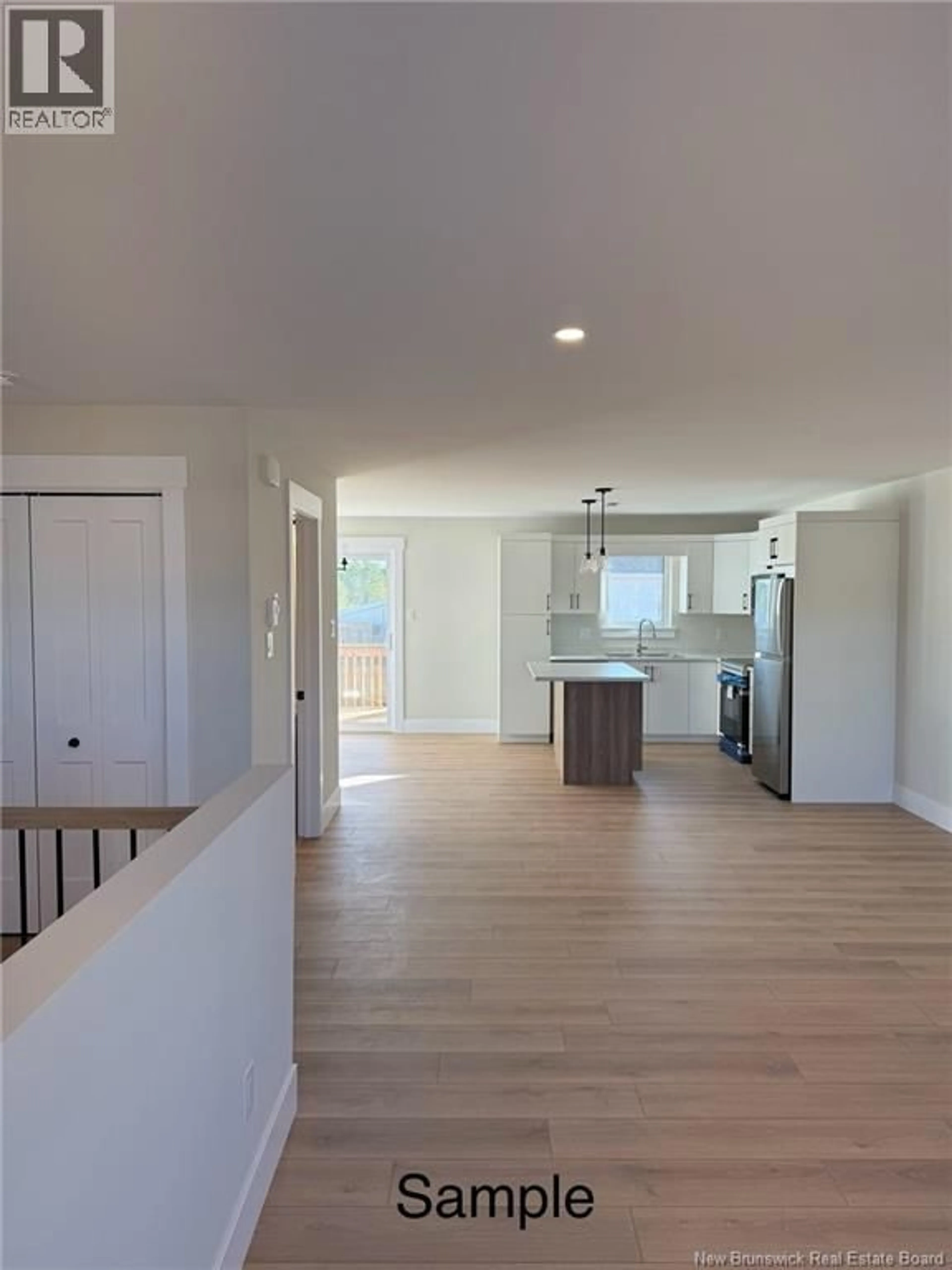 Open concept kitchen, wood/laminate floor for 69 ALOSIER CRESCENT, Moncton New Brunswick E1K0A1