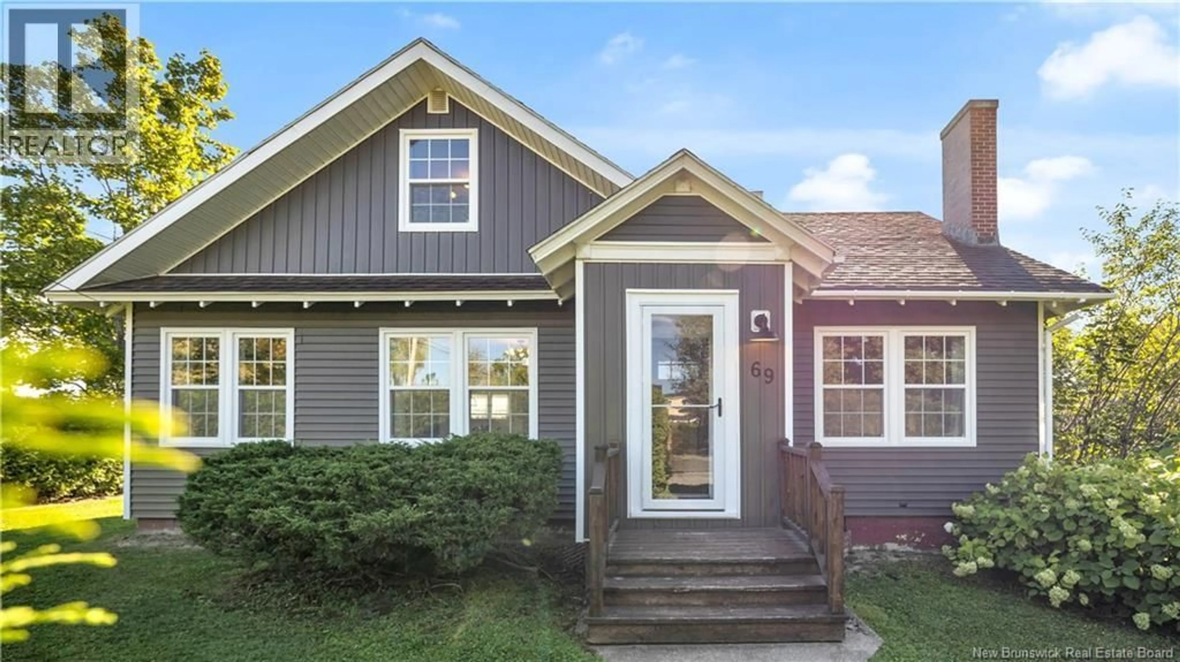 Home with vinyl exterior material, street for 69 MAIN STREET, St. Stephen New Brunswick E3L1Z8