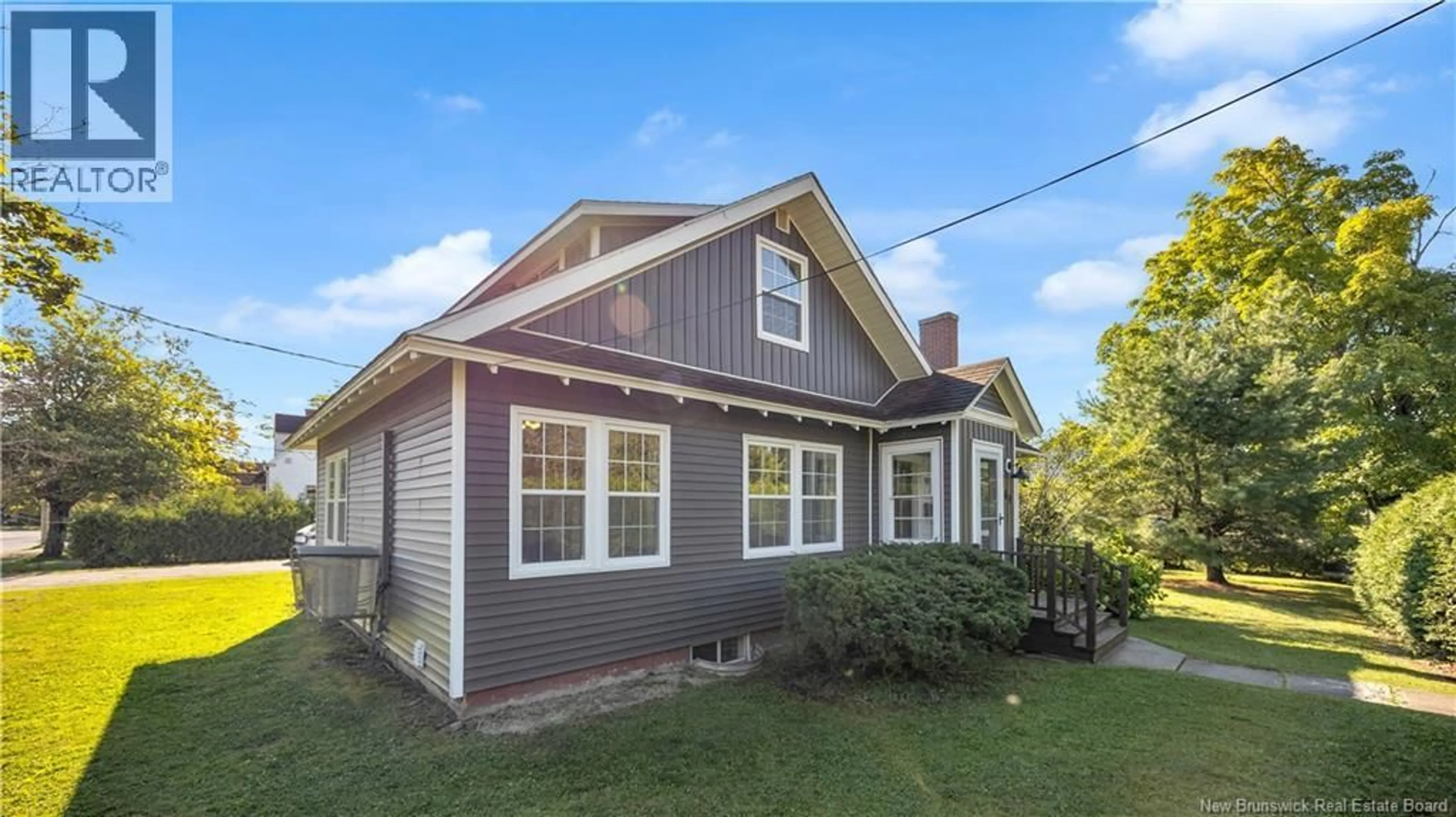 Home with vinyl exterior material, street for 69 MAIN STREET, St. Stephen New Brunswick E3L1Z8