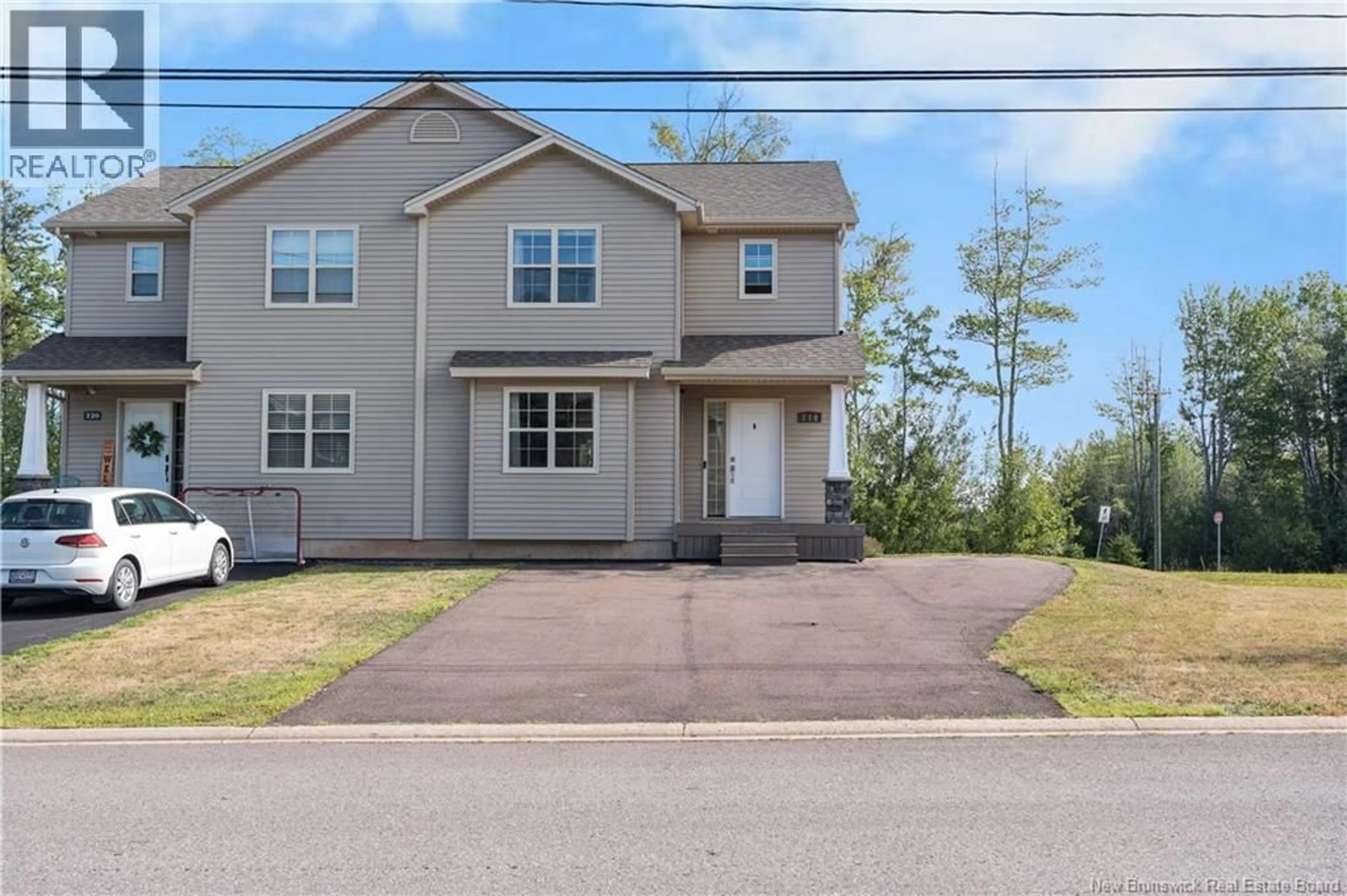 Home with vinyl exterior material, street for 218 ERINVALE DRIVE, Moncton New Brunswick E1A9S2
