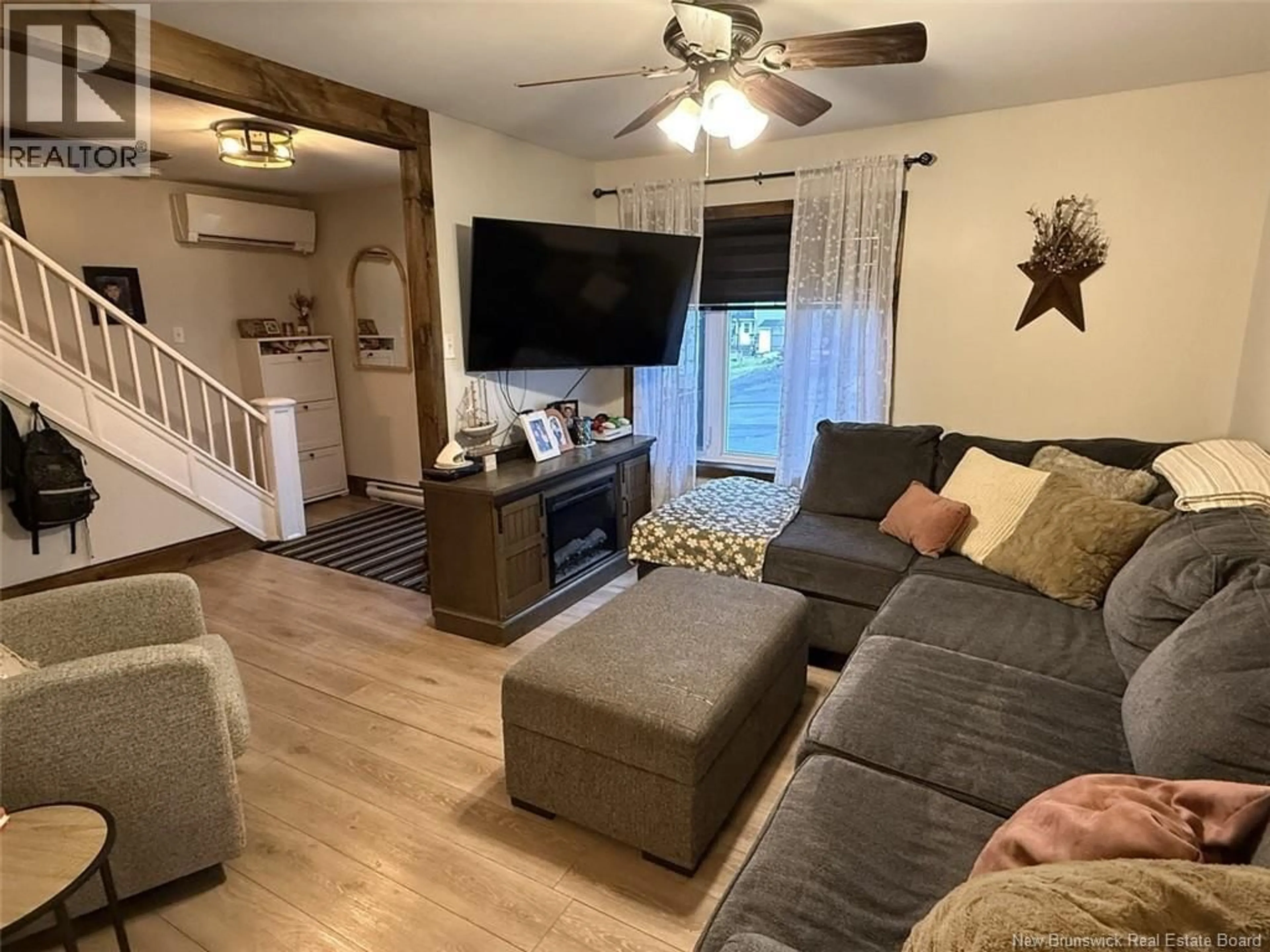 Living room with furniture, wood/laminate floor for 75 35TH AVENUE, Edmundston New Brunswick E3V2V1