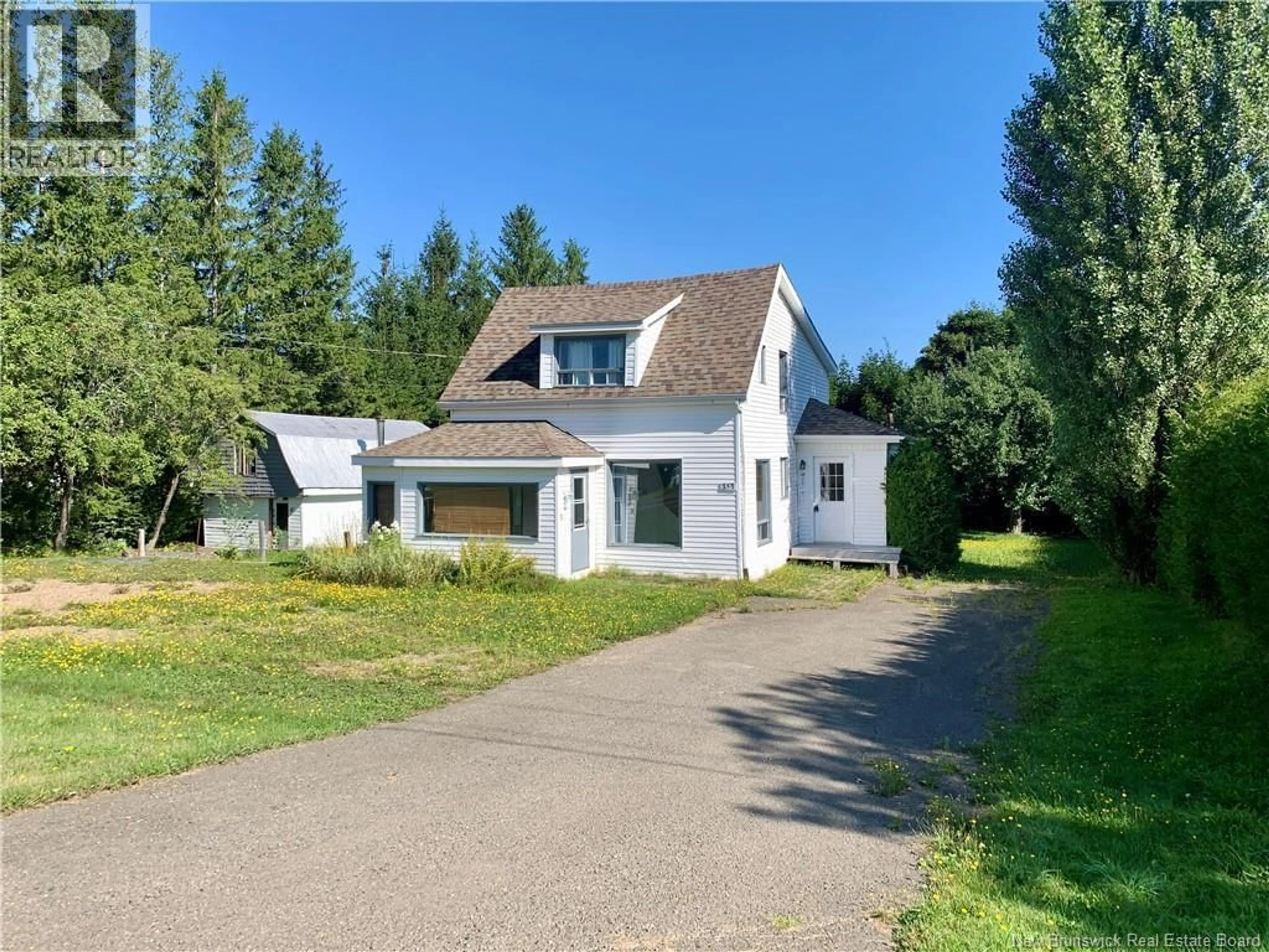 A pic from outside/outdoor area/front of a property/back of a property/a pic from drone, street for 453 CHALEUR, Charlo New Brunswick E8E2B9