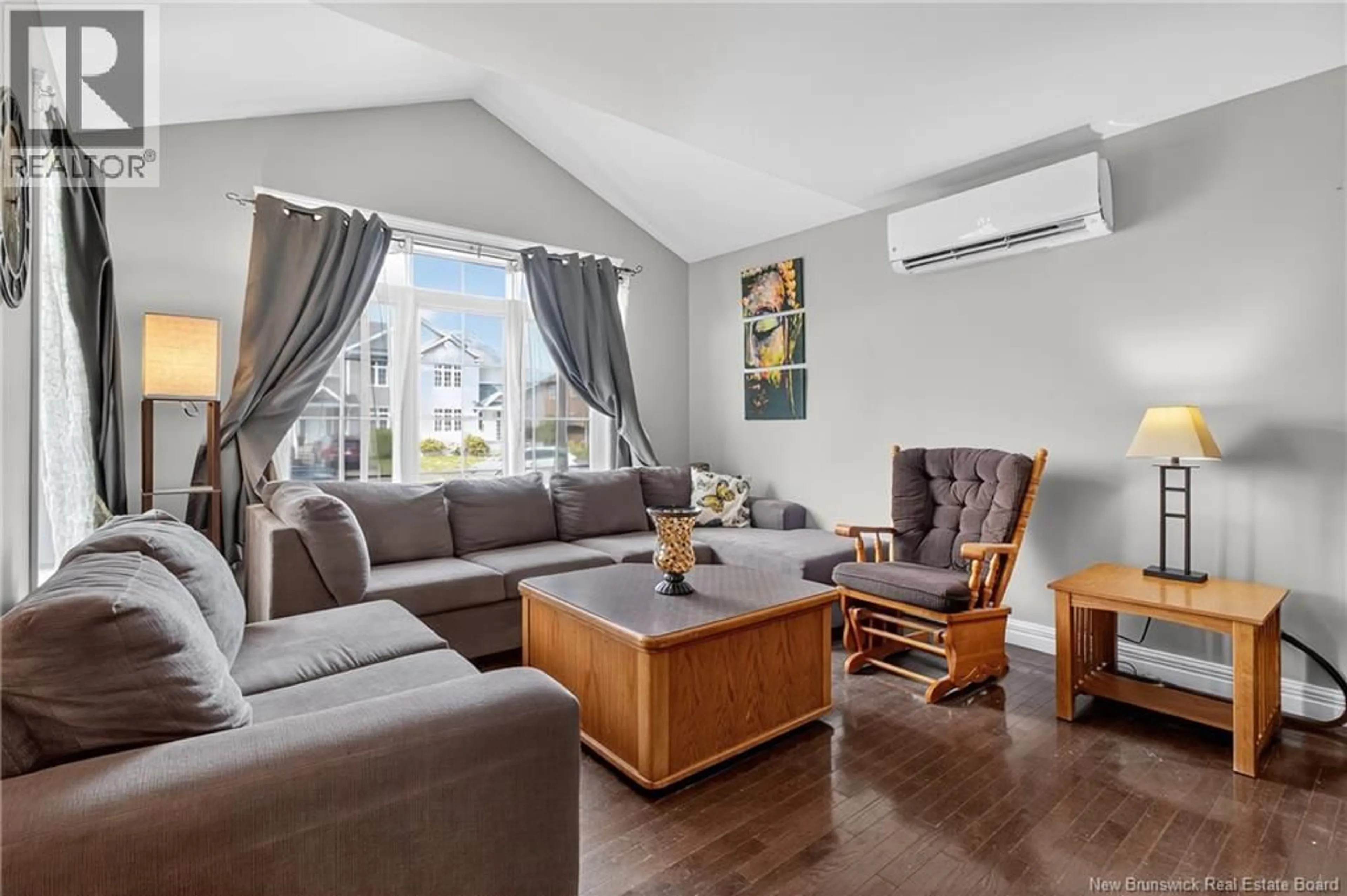 Living room with furniture, wood/laminate floor for 11 HOULAHAN, Dieppe New Brunswick E1A0S9