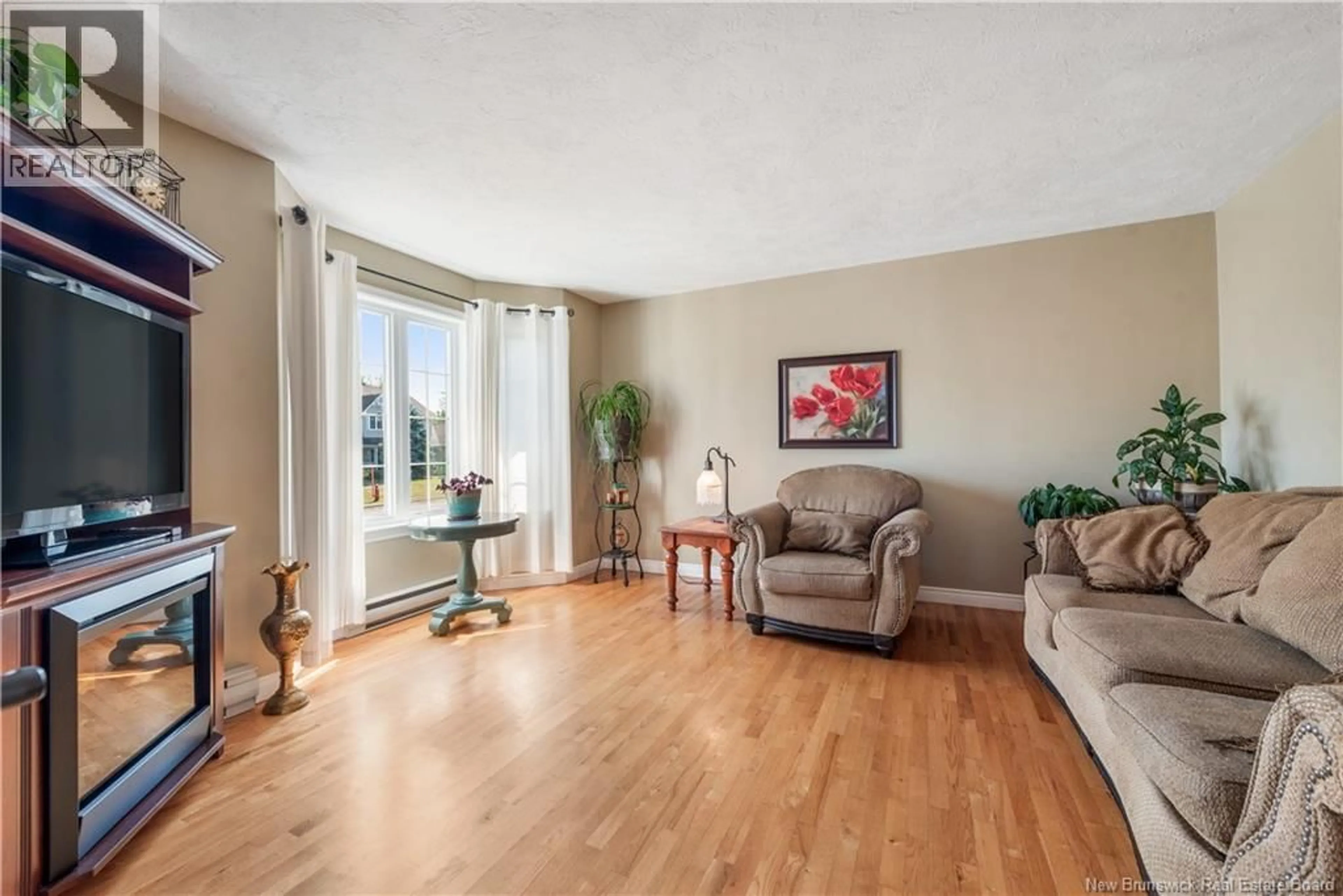 Living room with furniture, wood/laminate floor for 153 ELMHURST, Moncton New Brunswick E1C9V4