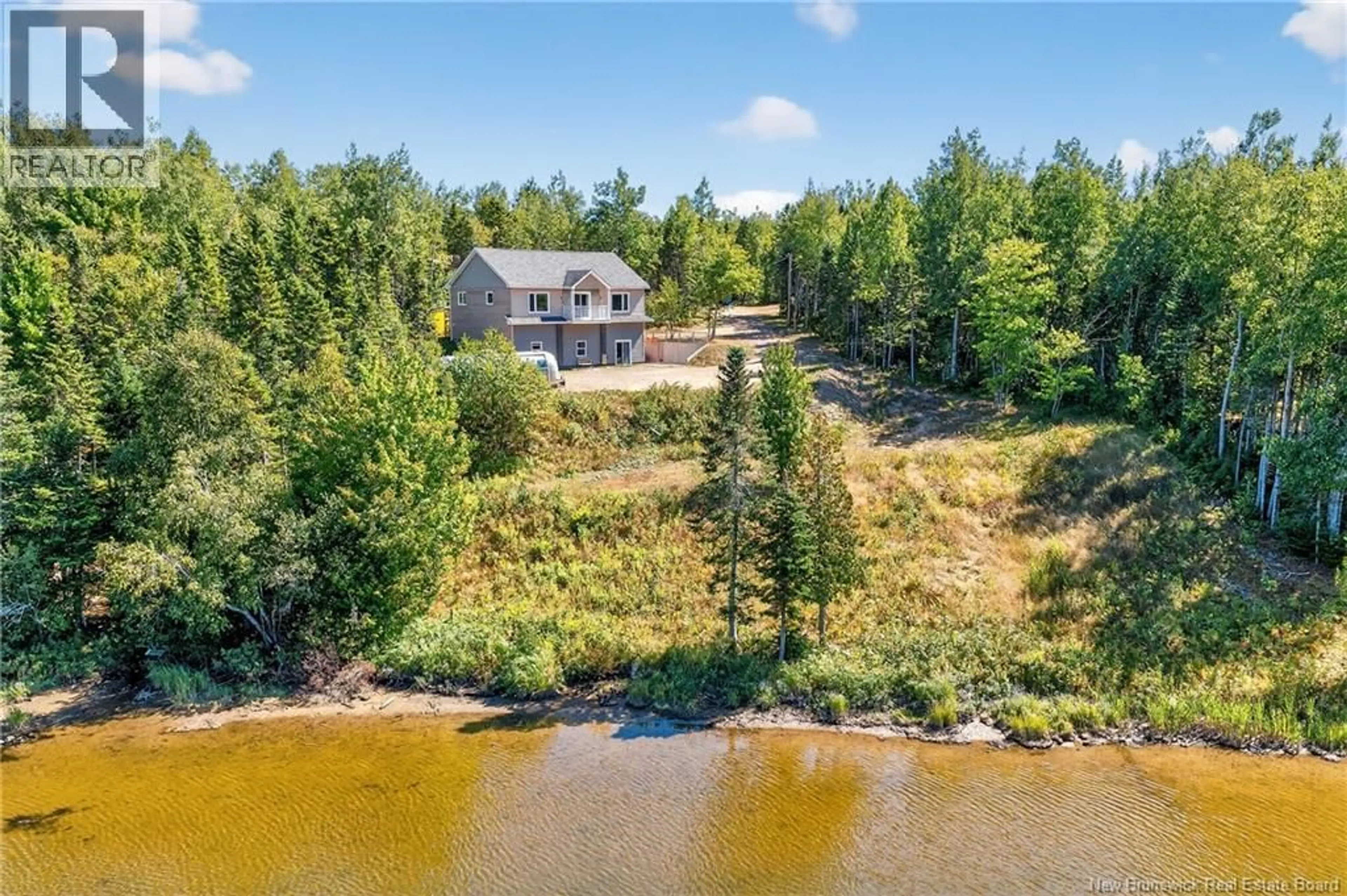 A pic from outside/outdoor area/front of a property/back of a property/a pic from drone, water/lake/river/ocean view for 38 ALLÉE CÉCILE, Petit-Tracadie New Brunswick E1X0J2