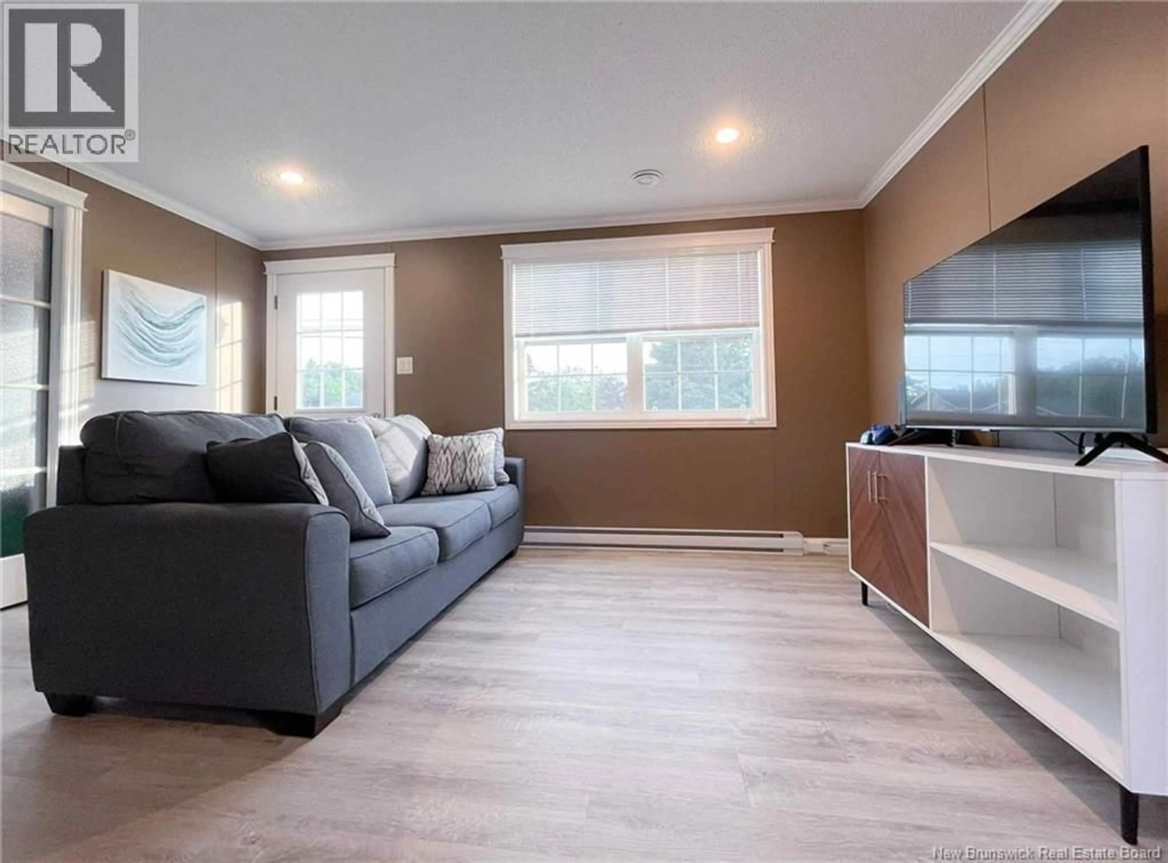 Living room with furniture, wood/laminate floor for 2368 ACADIE ROAD, Cap-Pelé New Brunswick E4N1C8