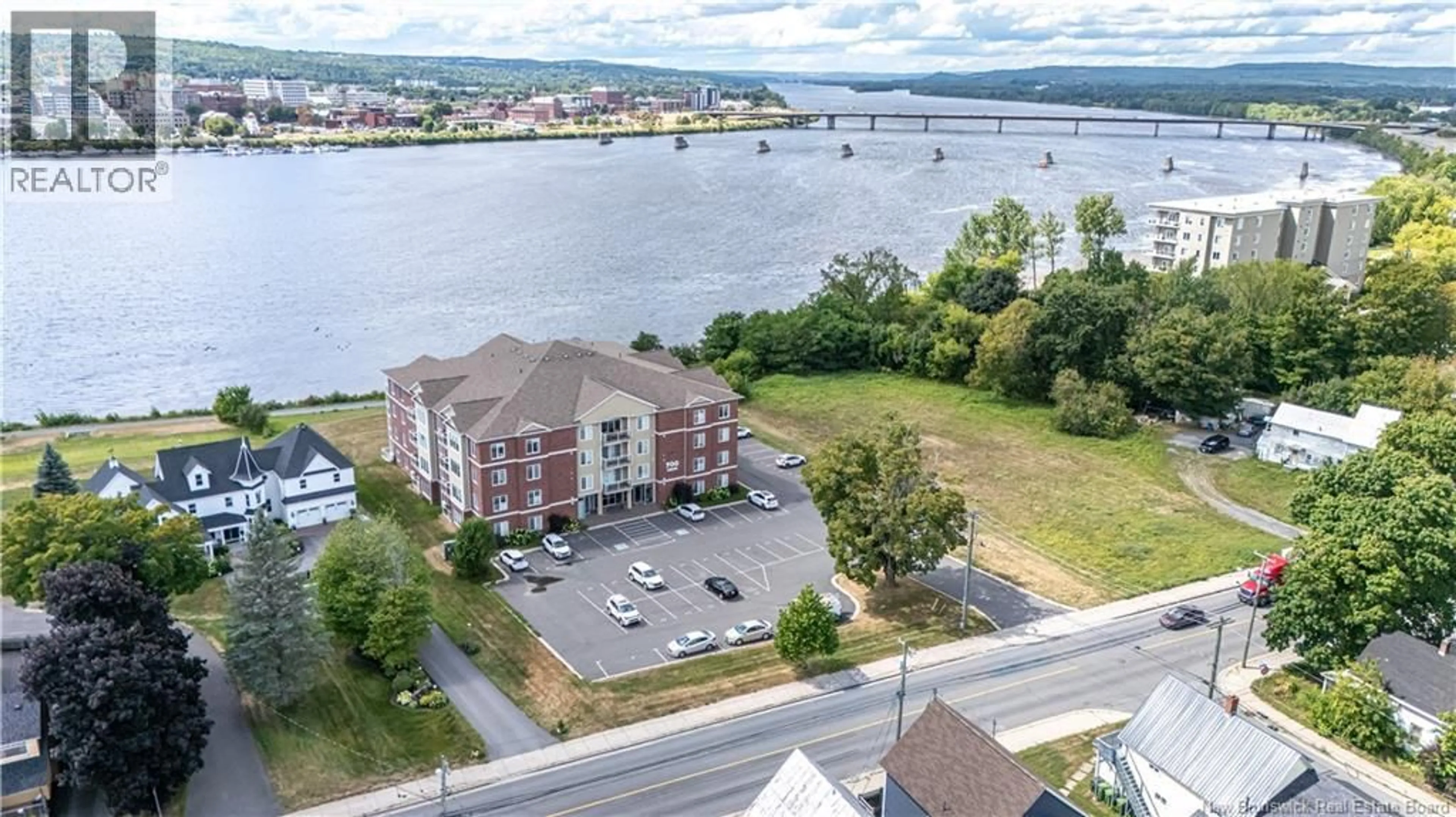 A pic from outside/outdoor area/front of a property/back of a property/a pic from drone, water/lake/river/ocean view for 203 - 700 UNION STREET, Fredericton New Brunswick E3A3N7