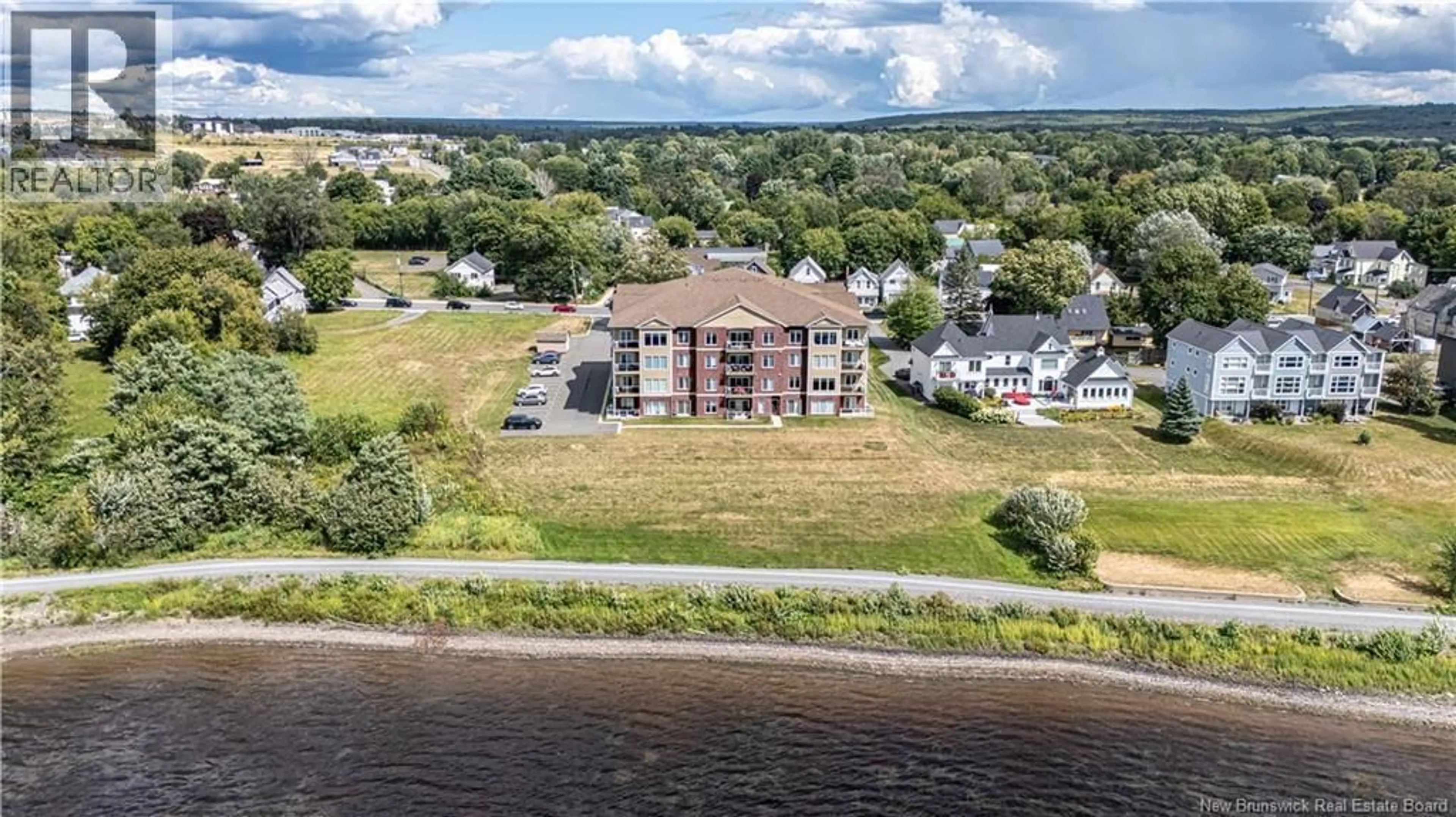A pic from outside/outdoor area/front of a property/back of a property/a pic from drone, water/lake/river/ocean view for 203 - 700 UNION STREET, Fredericton New Brunswick E3A3N7