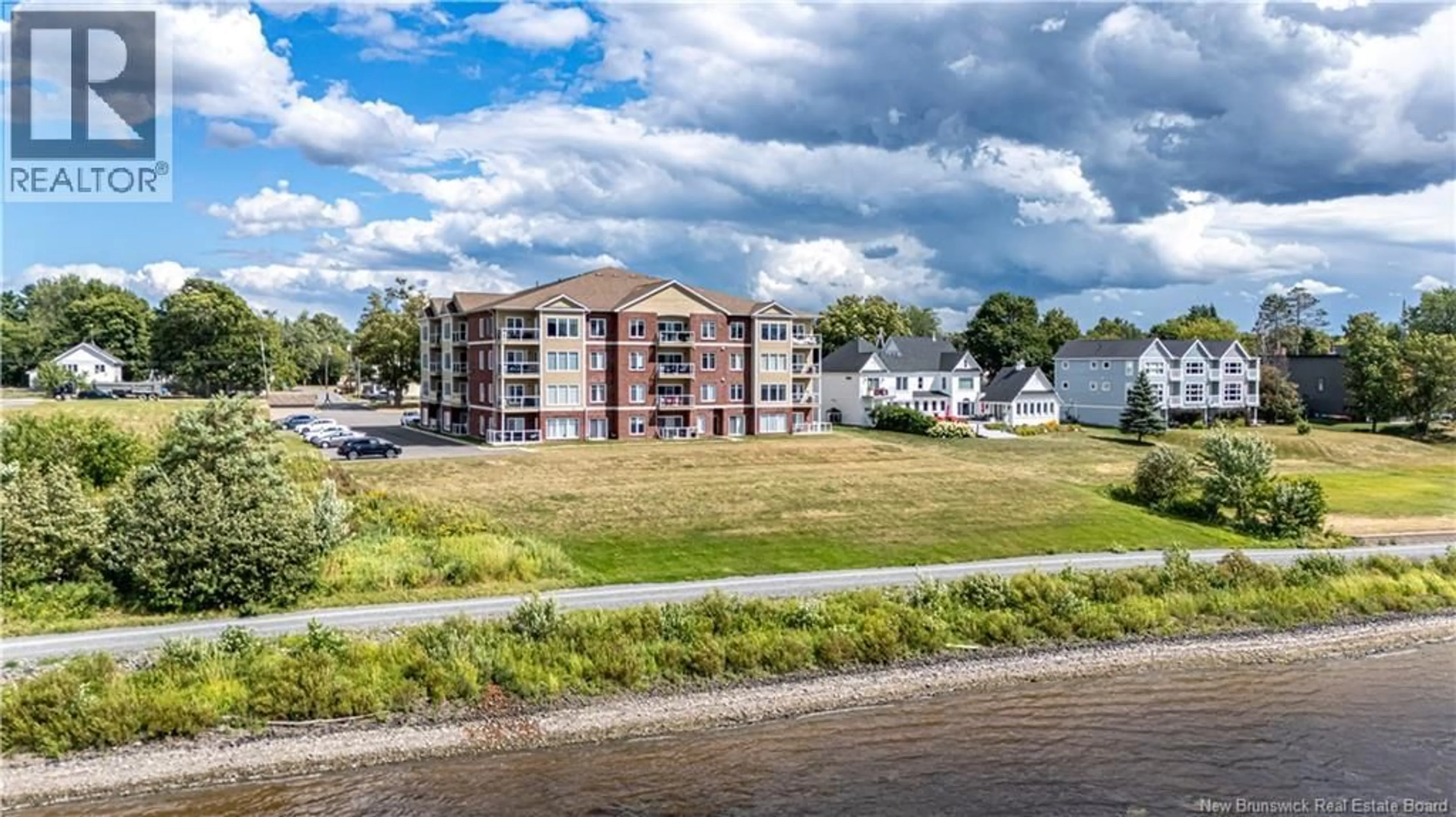 A pic from outside/outdoor area/front of a property/back of a property/a pic from drone, water/lake/river/ocean view for 203 - 700 UNION STREET, Fredericton New Brunswick E3A3N7