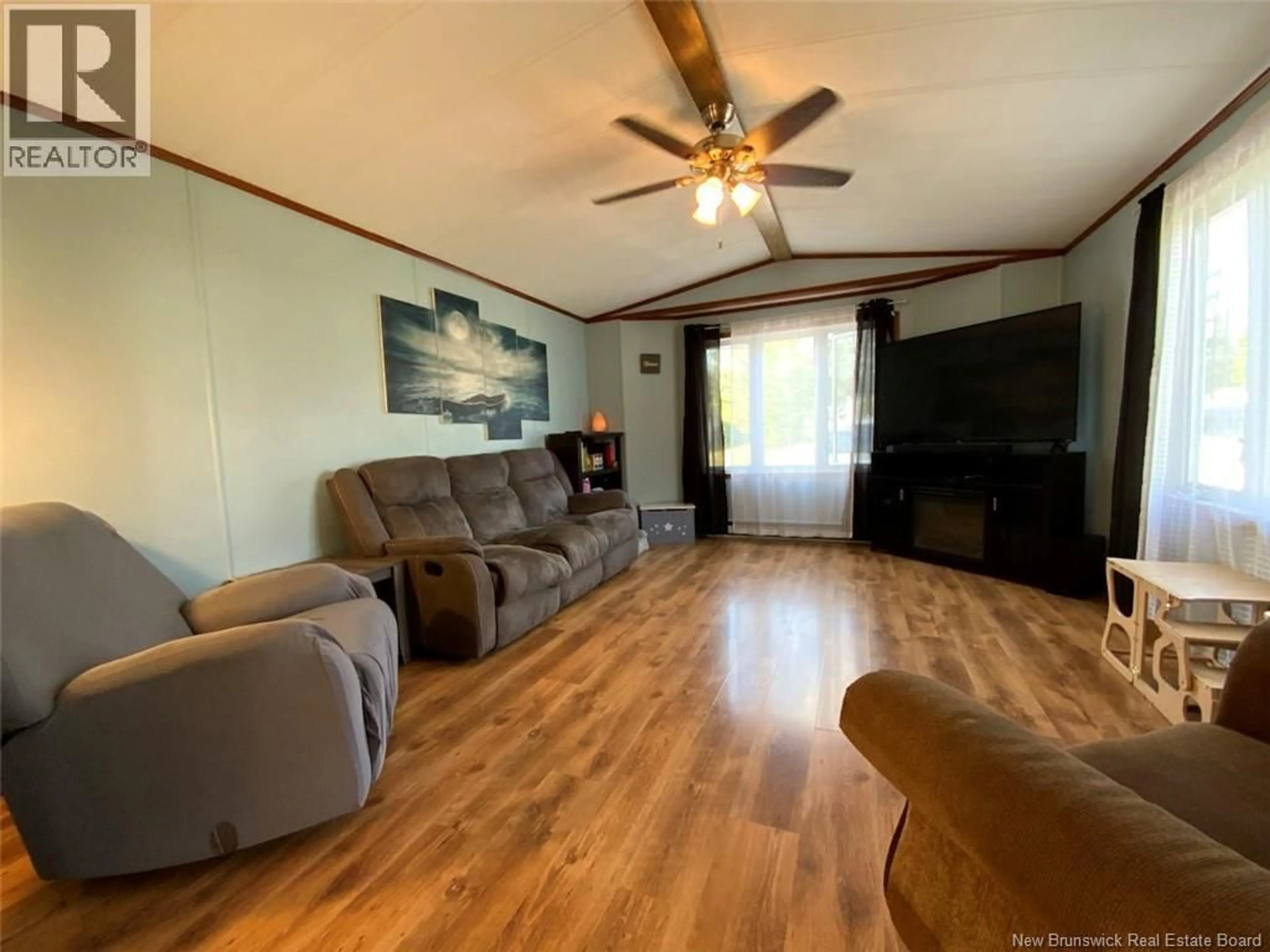 Living room with furniture, wood/laminate floor for 56 LE PARADIS ROAD, Saint-Jacques New Brunswick E7B1V1