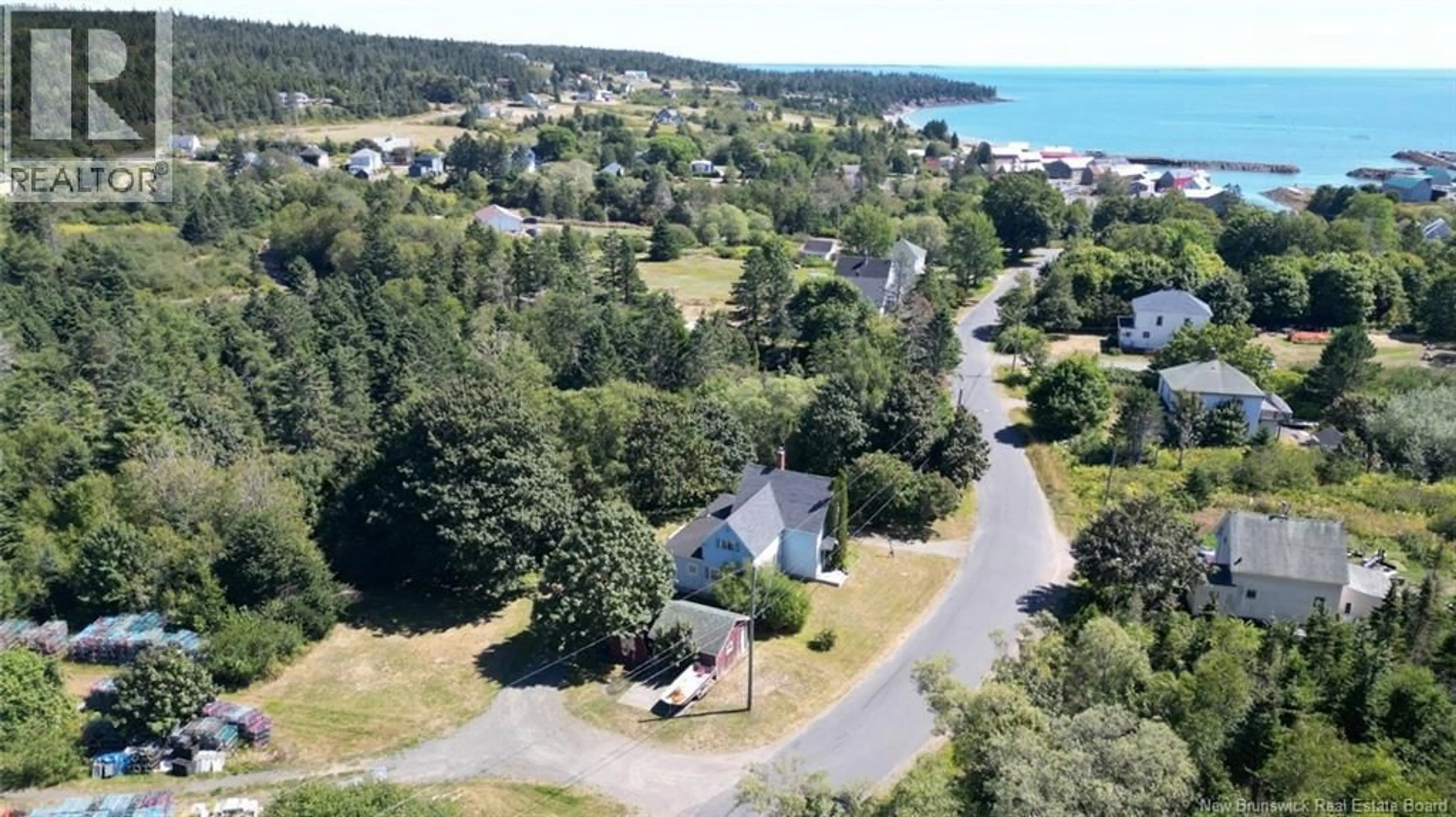 A pic from outside/outdoor area/front of a property/back of a property/a pic from drone, water/lake/river/ocean view for 28 KING STREET, Grand Manan New Brunswick E5G3J1