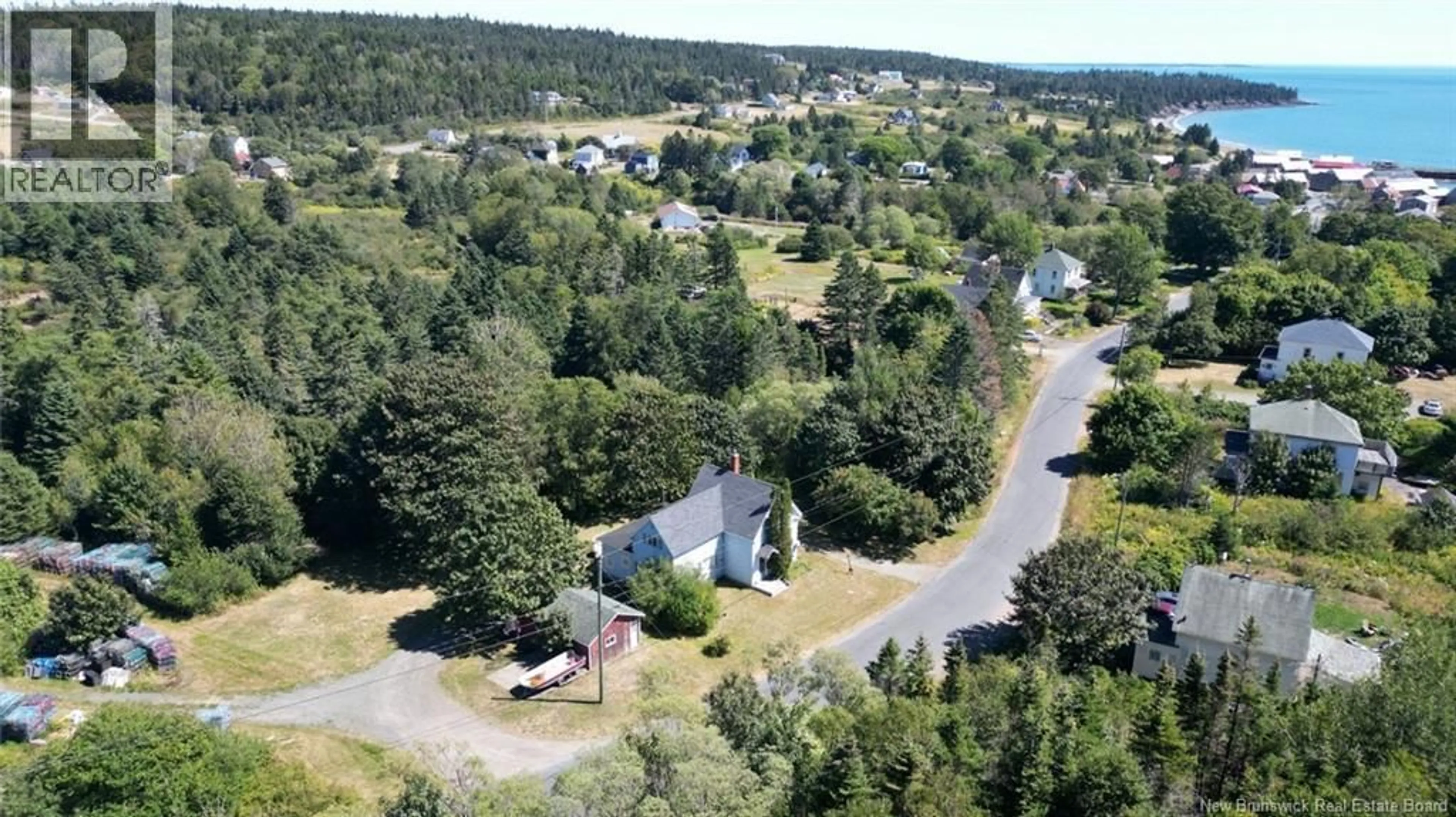 A pic from outside/outdoor area/front of a property/back of a property/a pic from drone, street for 28 KING STREET, Grand Manan New Brunswick E5G3J1