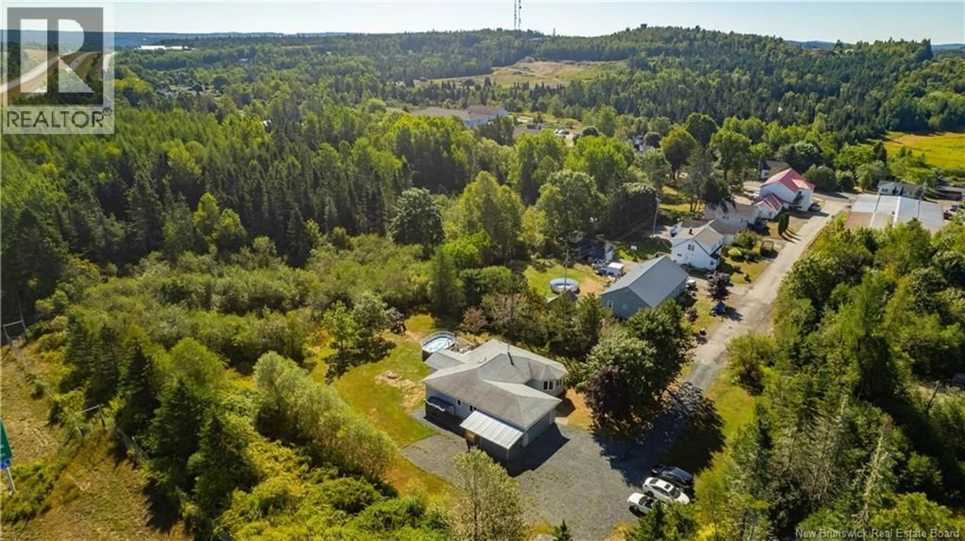 A pic from outside/outdoor area/front of a property/back of a property/a pic from drone, forest/trees view for 18 TRYNOR STREET, St George New Brunswick E5C3N9