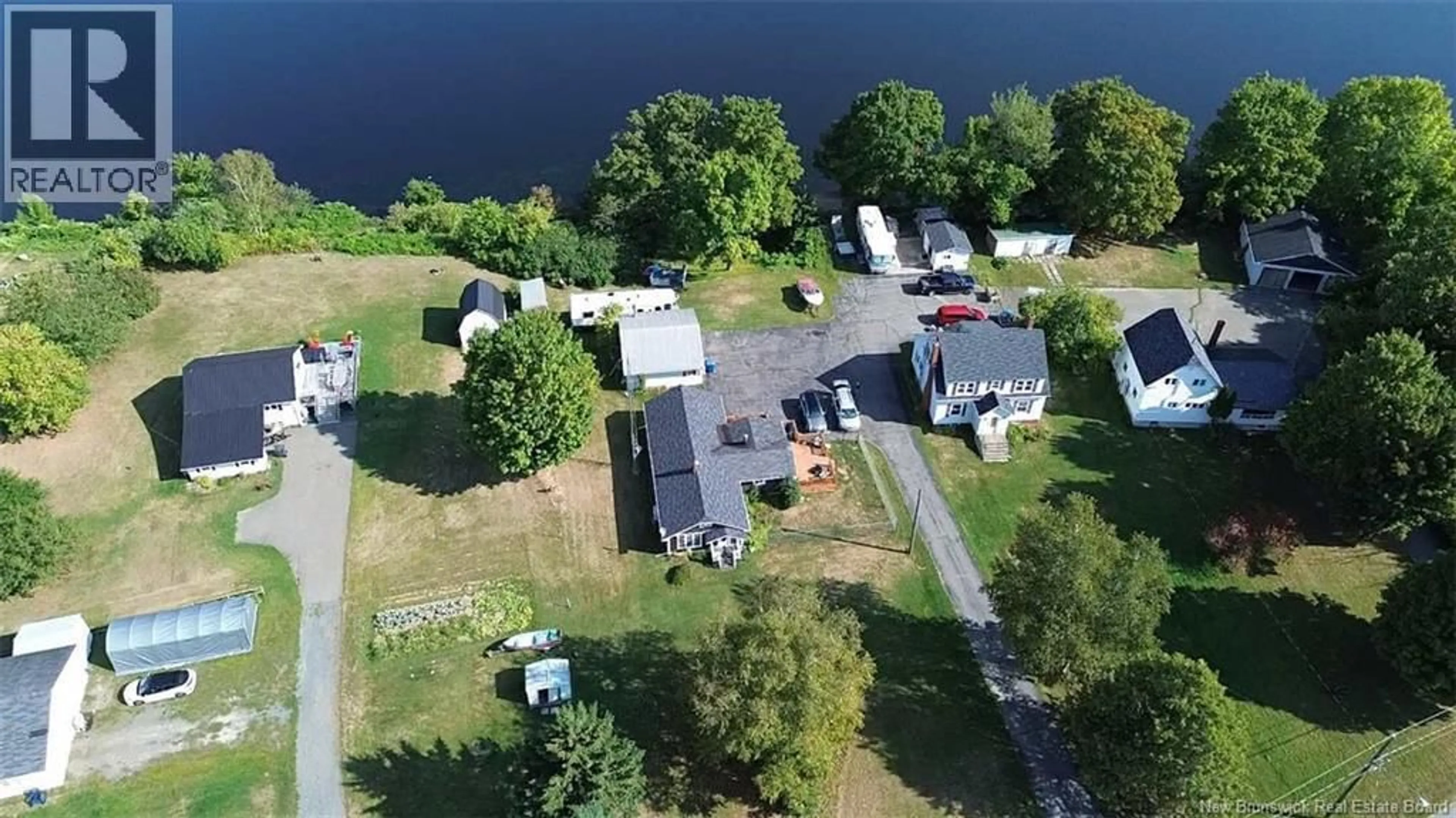 A pic from outside/outdoor area/front of a property/back of a property/a pic from drone, water/lake/river/ocean view for 55 MAIN STREET, Meductic New Brunswick E6H1E3