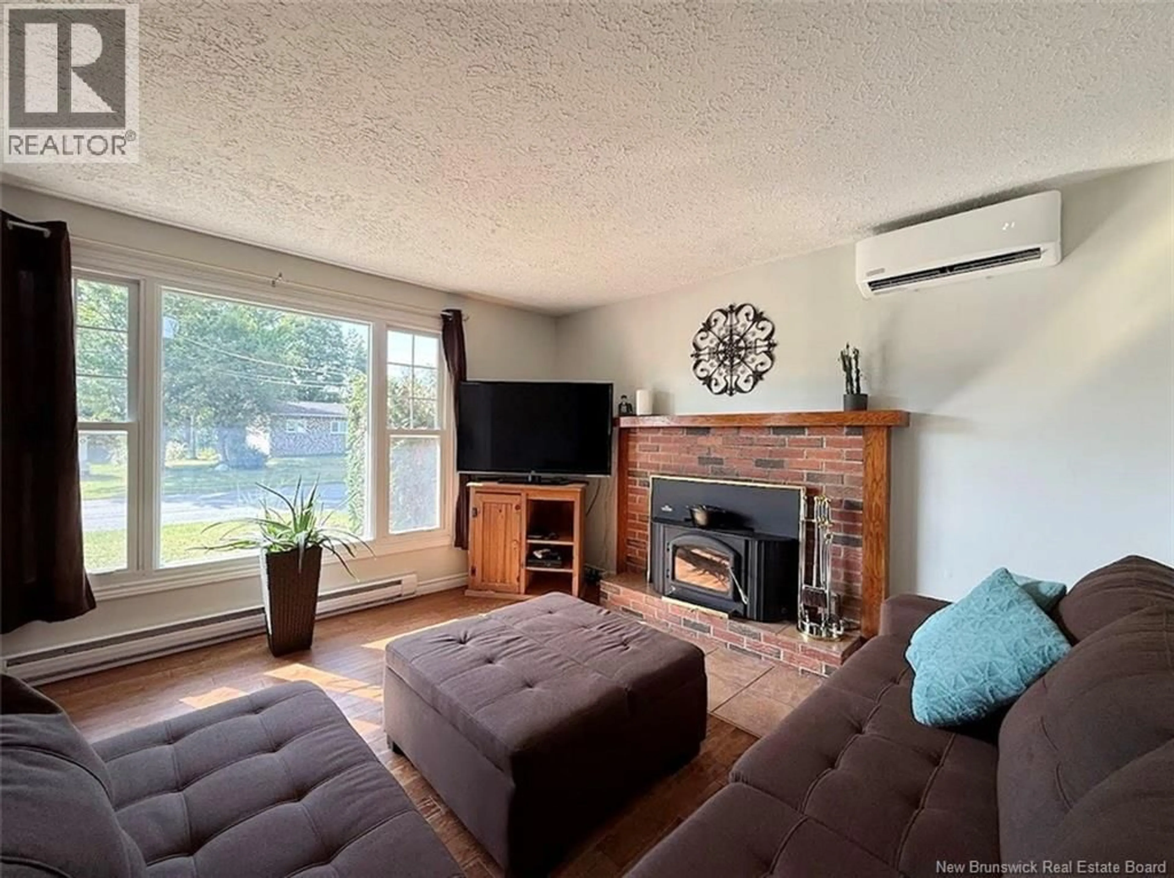 Living room with furniture, wood/laminate floor for 12 ST-JOSEPH STREET, Saint-Jacques New Brunswick E7B1P1