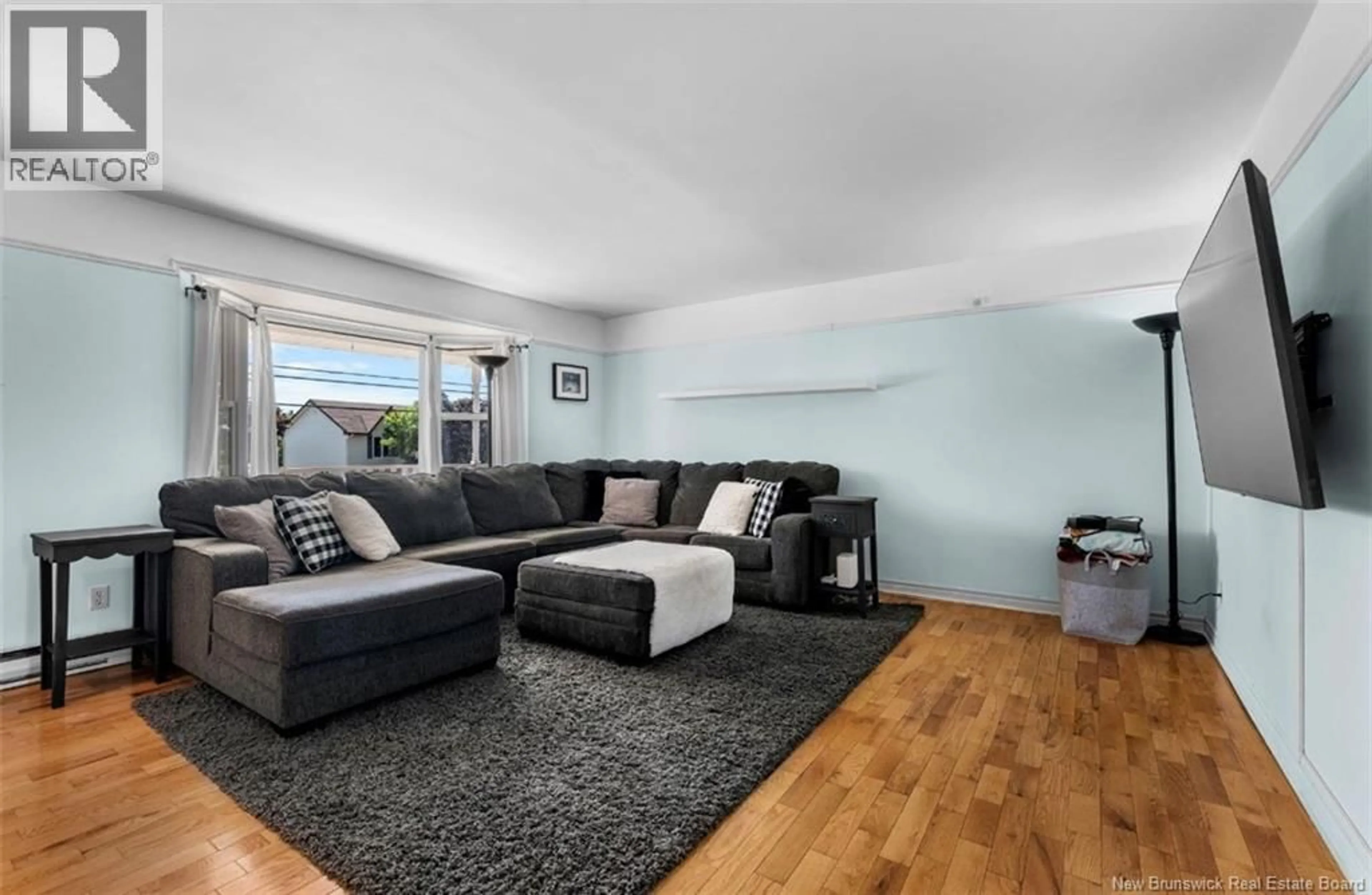 Living room with furniture, wood/laminate floor for 21 RENNICK ROAD, Moncton New Brunswick E1G2G8