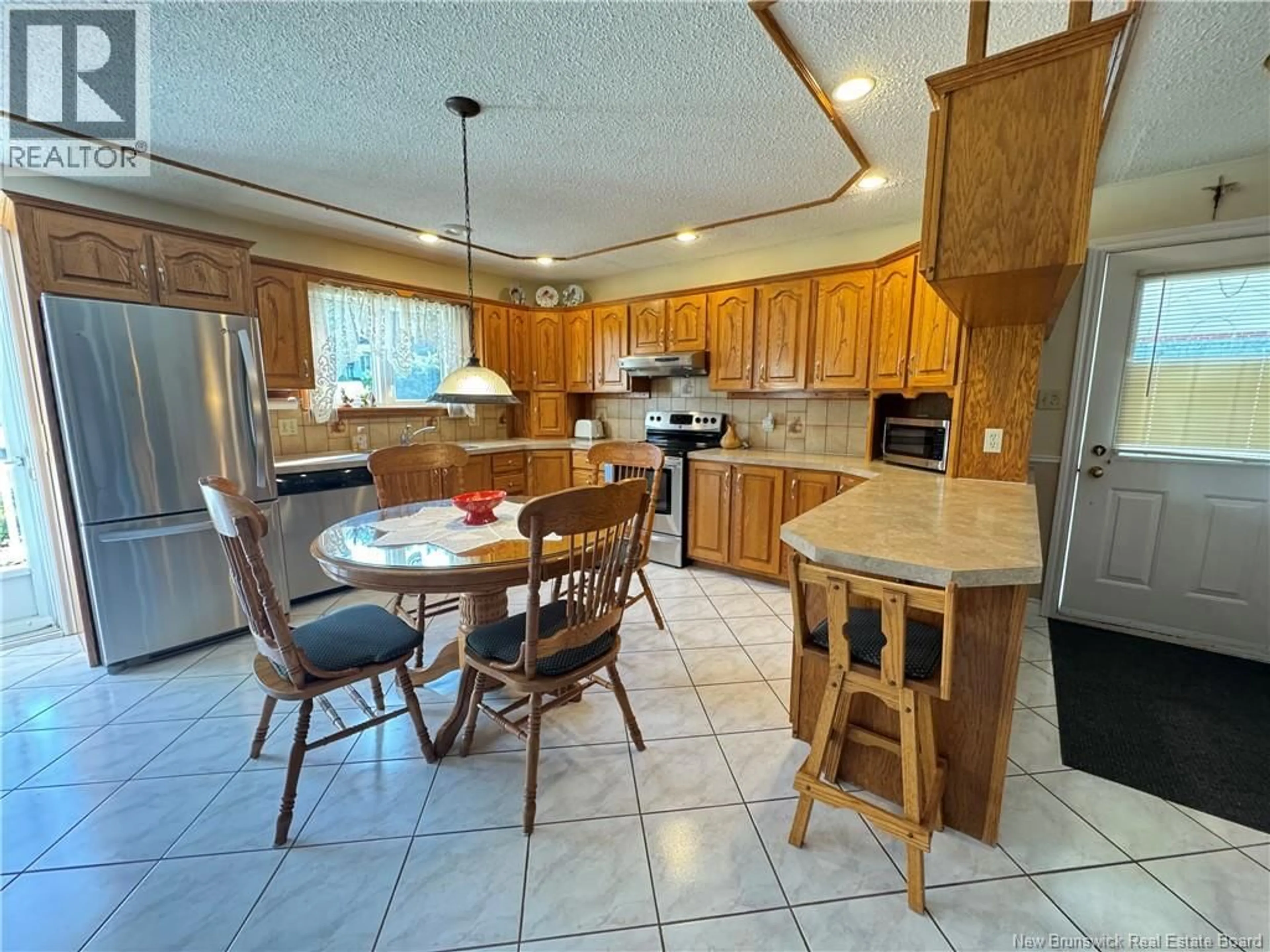 Open concept kitchen, ceramic/tile floor for 335 ALLAIN STREET, Grand-Sault/Grand Falls New Brunswick E3Y1E4