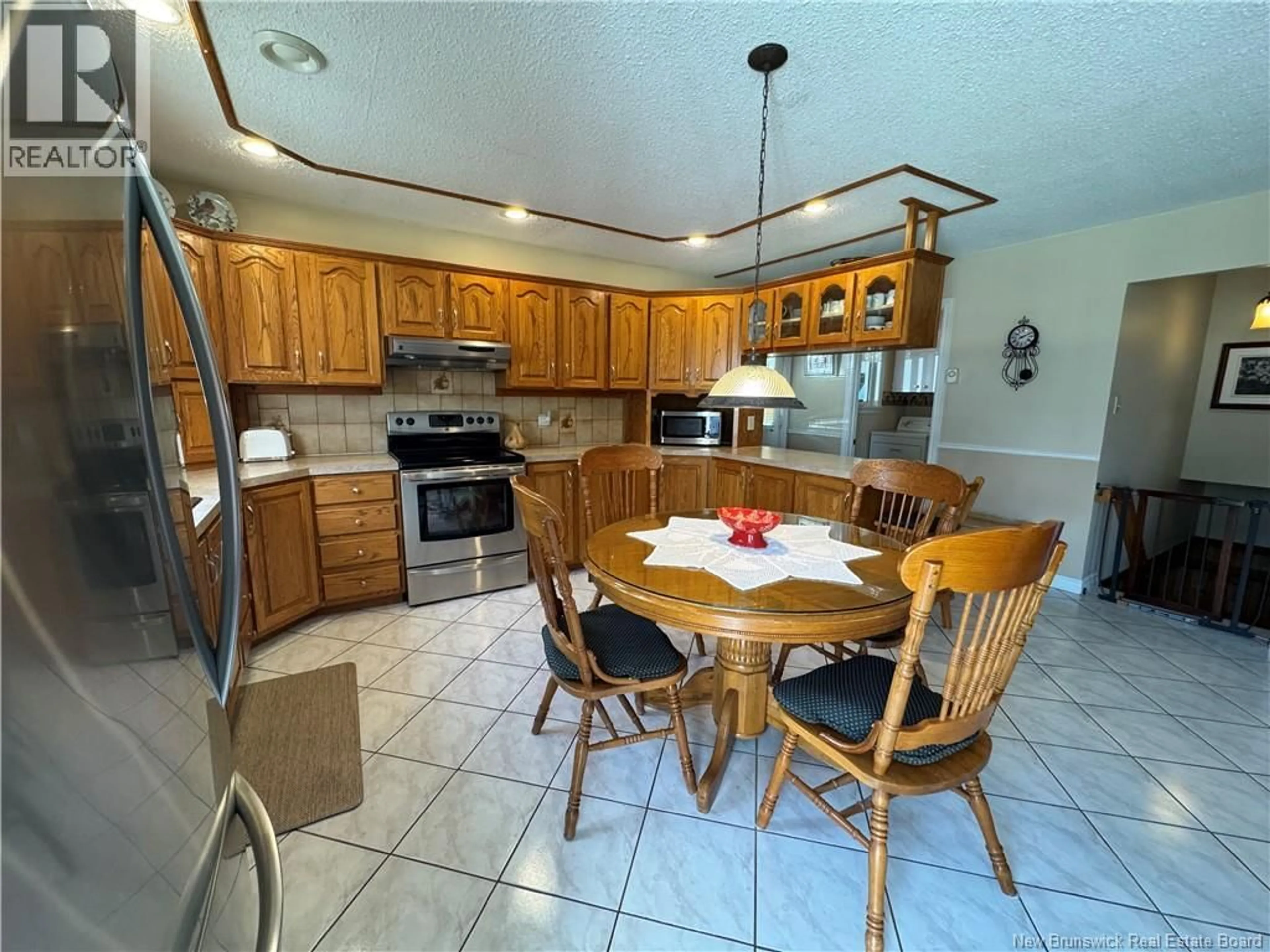 Open concept kitchen, ceramic/tile floor for 335 ALLAIN STREET, Grand-Sault/Grand Falls New Brunswick E3Y1E4