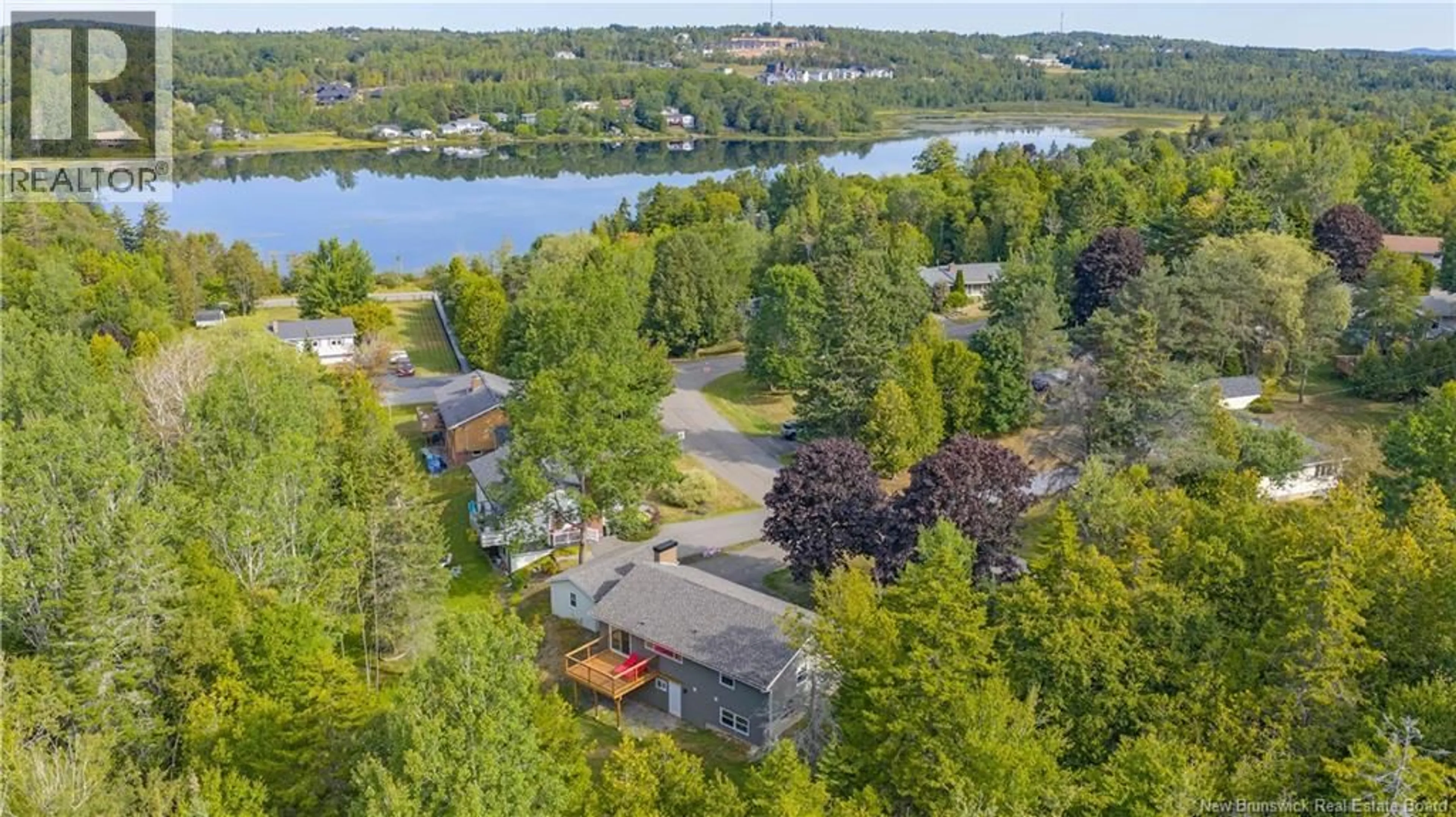 A pic from outside/outdoor area/front of a property/back of a property/a pic from drone, water/lake/river/ocean view for 9 STONEYCROFT ROAD, Quispamsis New Brunswick E2E4R1