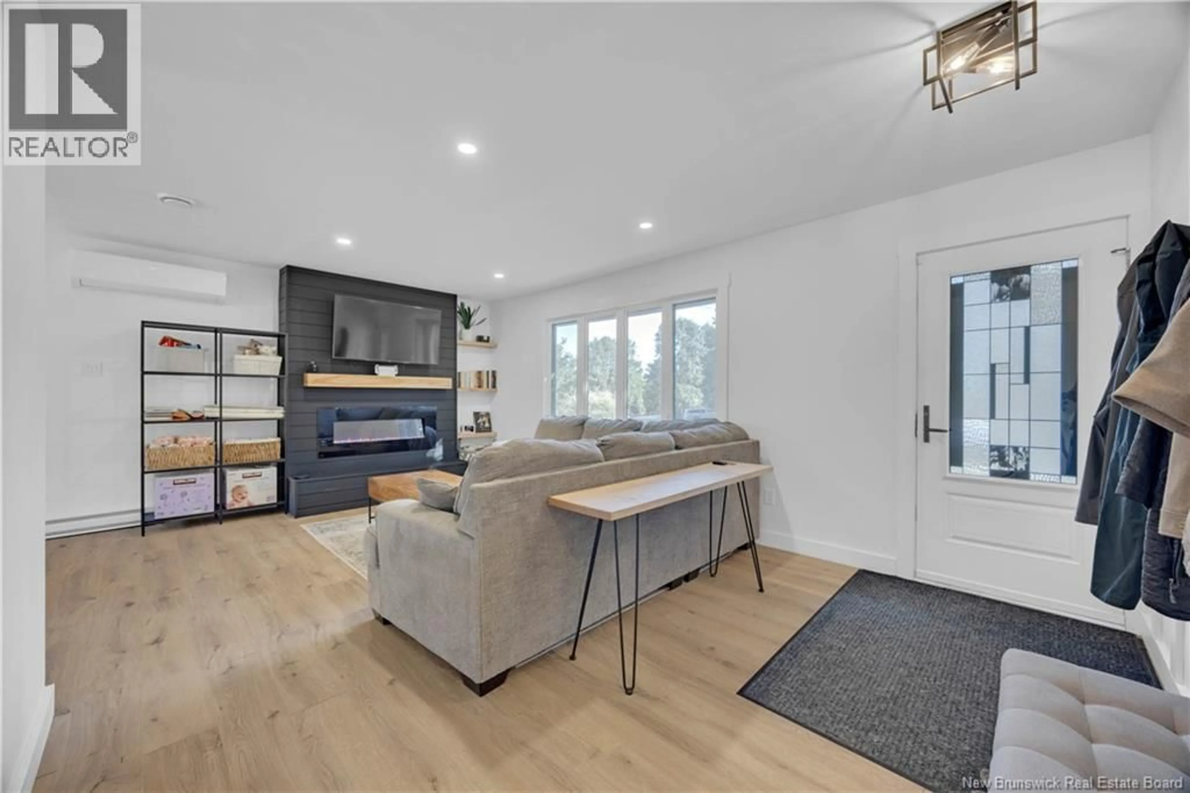 Living room with furniture, wood/laminate floor for 9 STONEYCROFT ROAD, Quispamsis New Brunswick E2E4R1