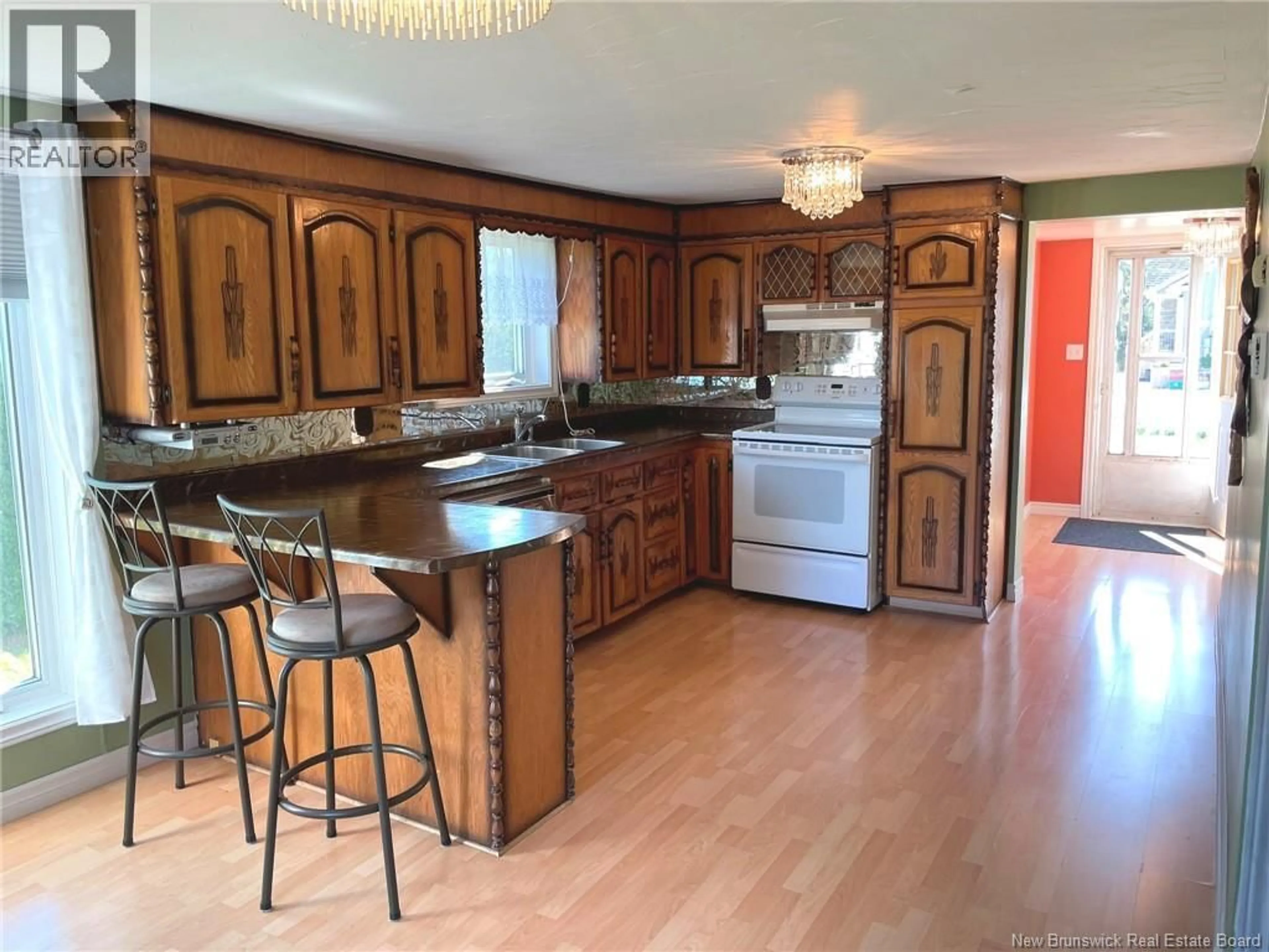 Open concept kitchen, wood/laminate floor for 546 DES MOULINS, Saint-Andre-LeBlanc New Brunswick E4P6A3