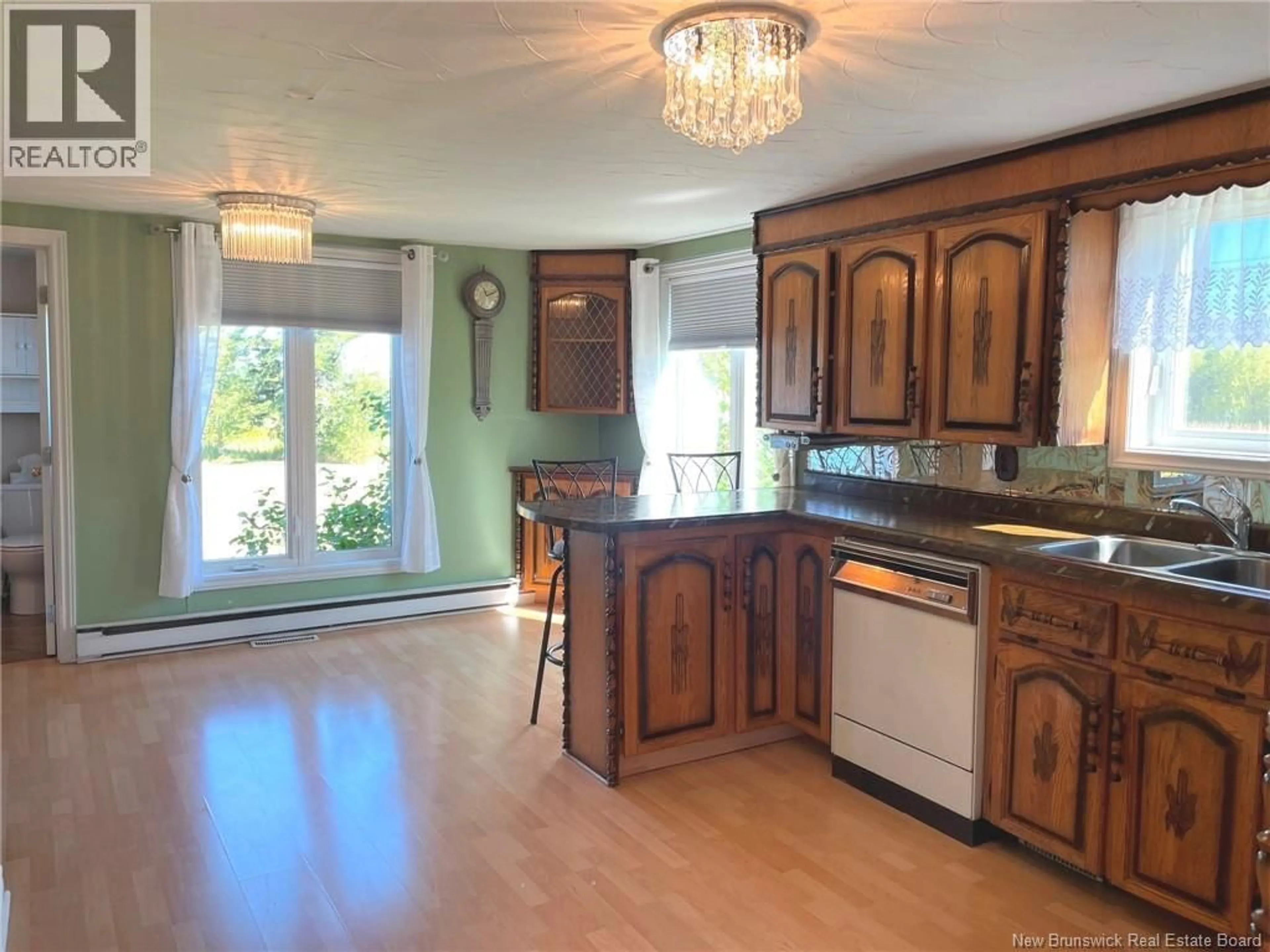 Open concept kitchen, wood/laminate floor for 546 DES MOULINS, Saint-Andre-LeBlanc New Brunswick E4P6A3