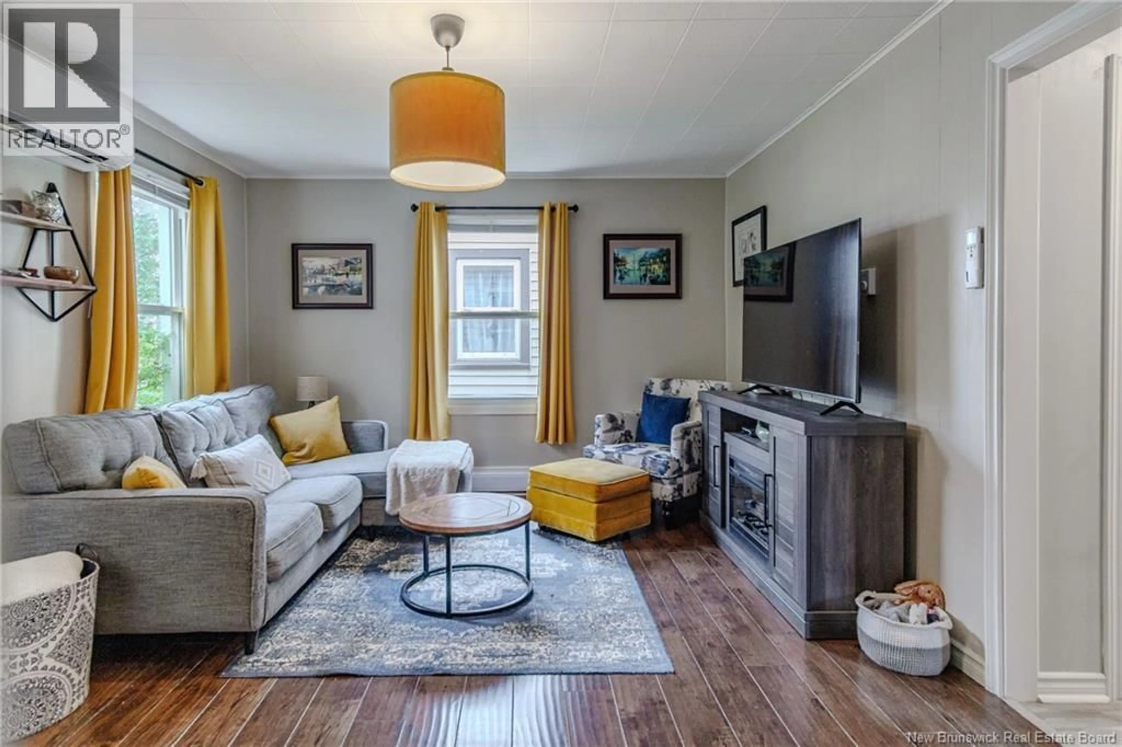 Living room with furniture, wood/laminate floor for 50 EDITH AVENUE, Saint John New Brunswick E2J1P4
