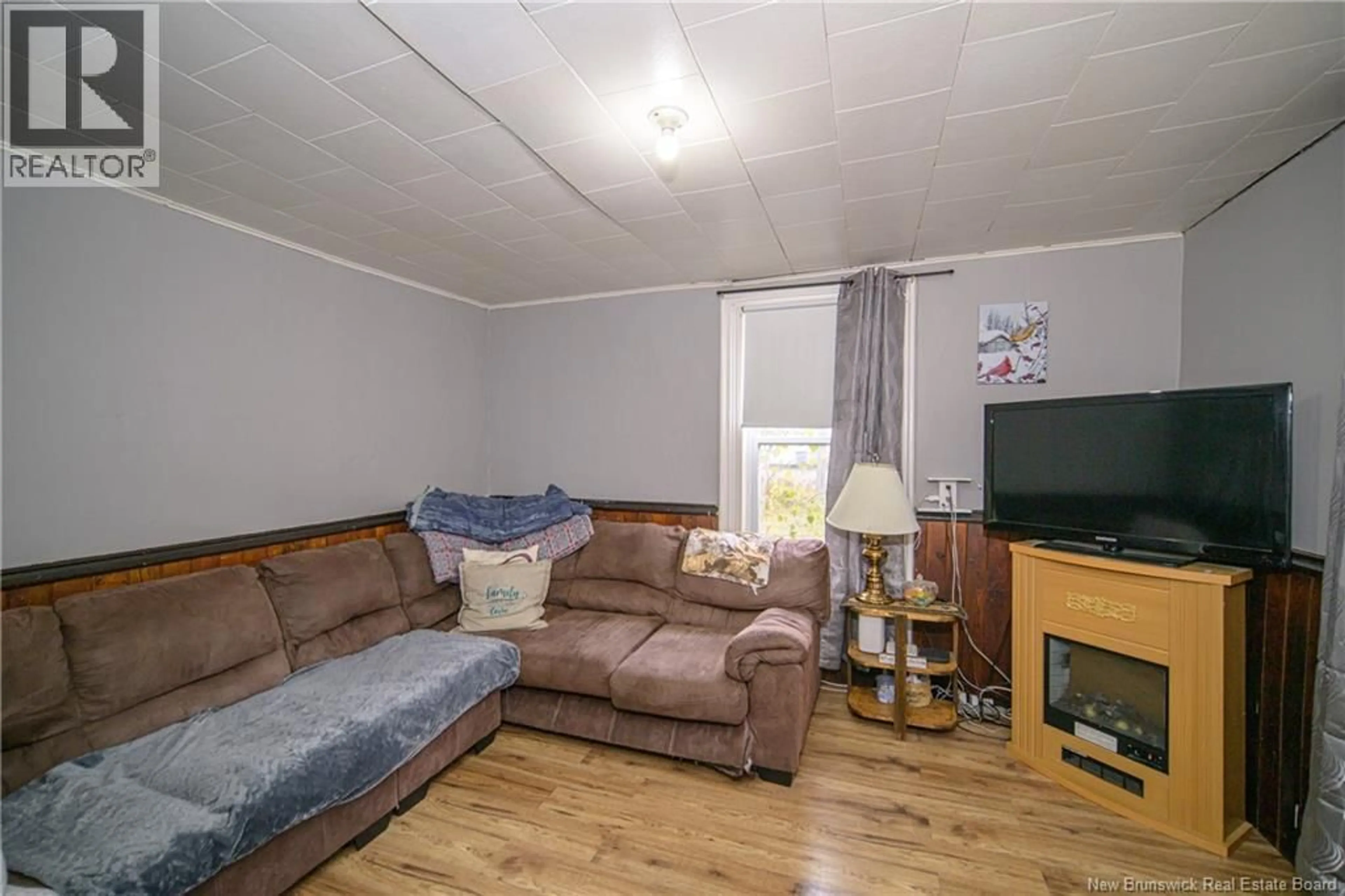 Living room with furniture, wood/laminate floor for 527 MAIN STREET, Doaktown New Brunswick E9C1W9