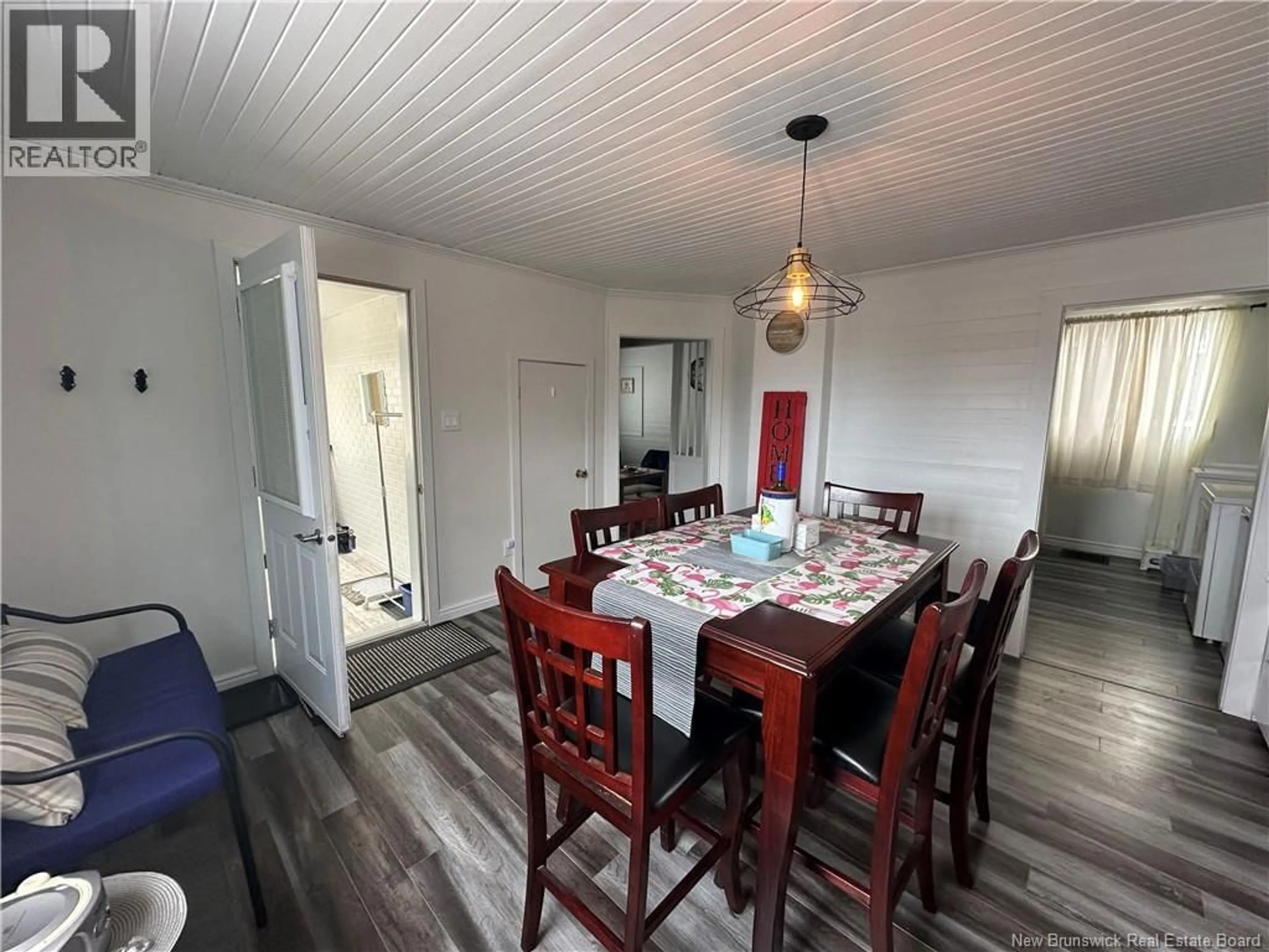 Dining room, wood/laminate floor for 213 NOTRE DAME STREET, Atholville New Brunswick E3N4T1