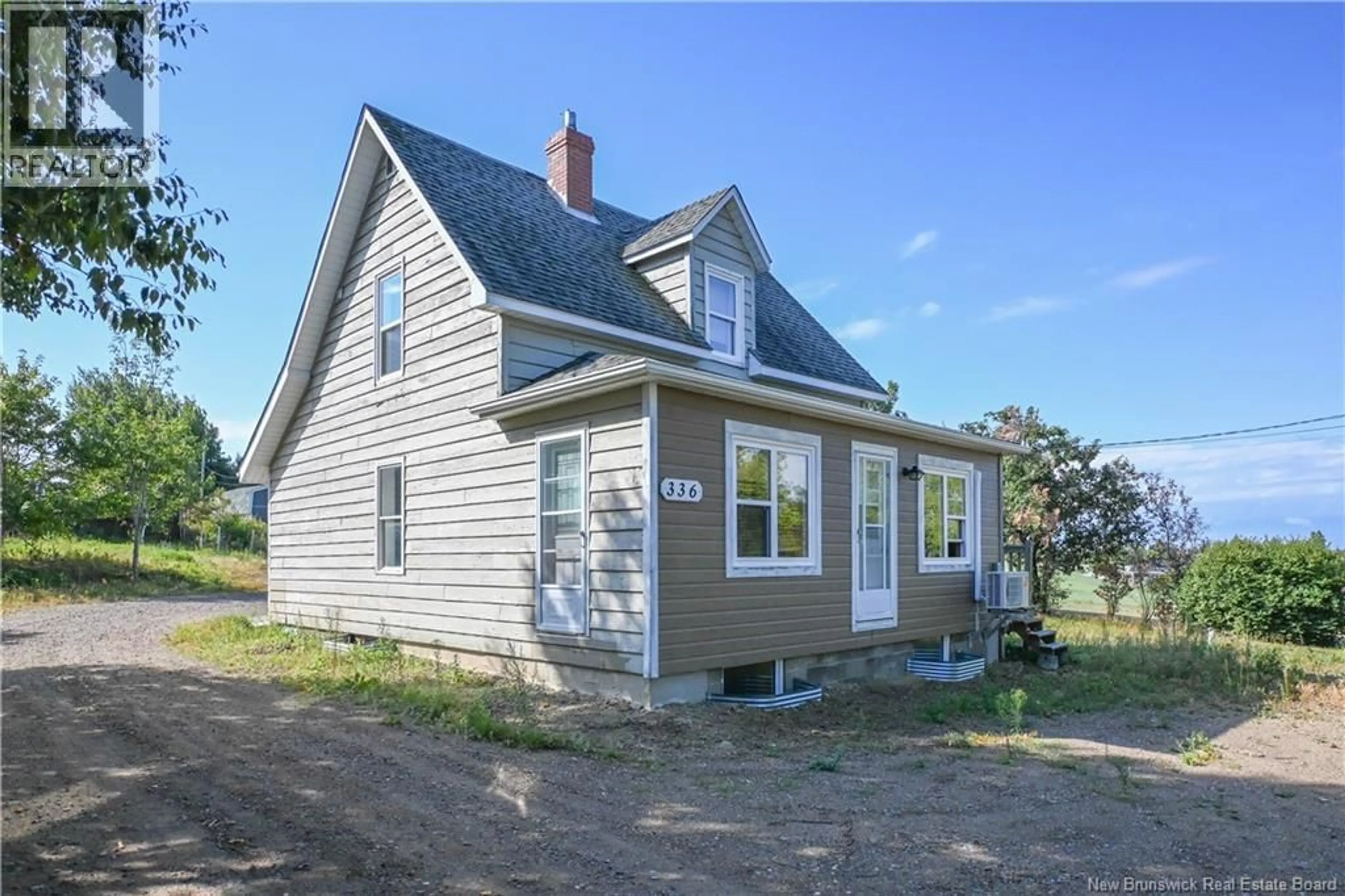 Home with vinyl exterior material, street for 336 SAINT-PIERRE BOULEVARD, Caraquet New Brunswick E1W1A3