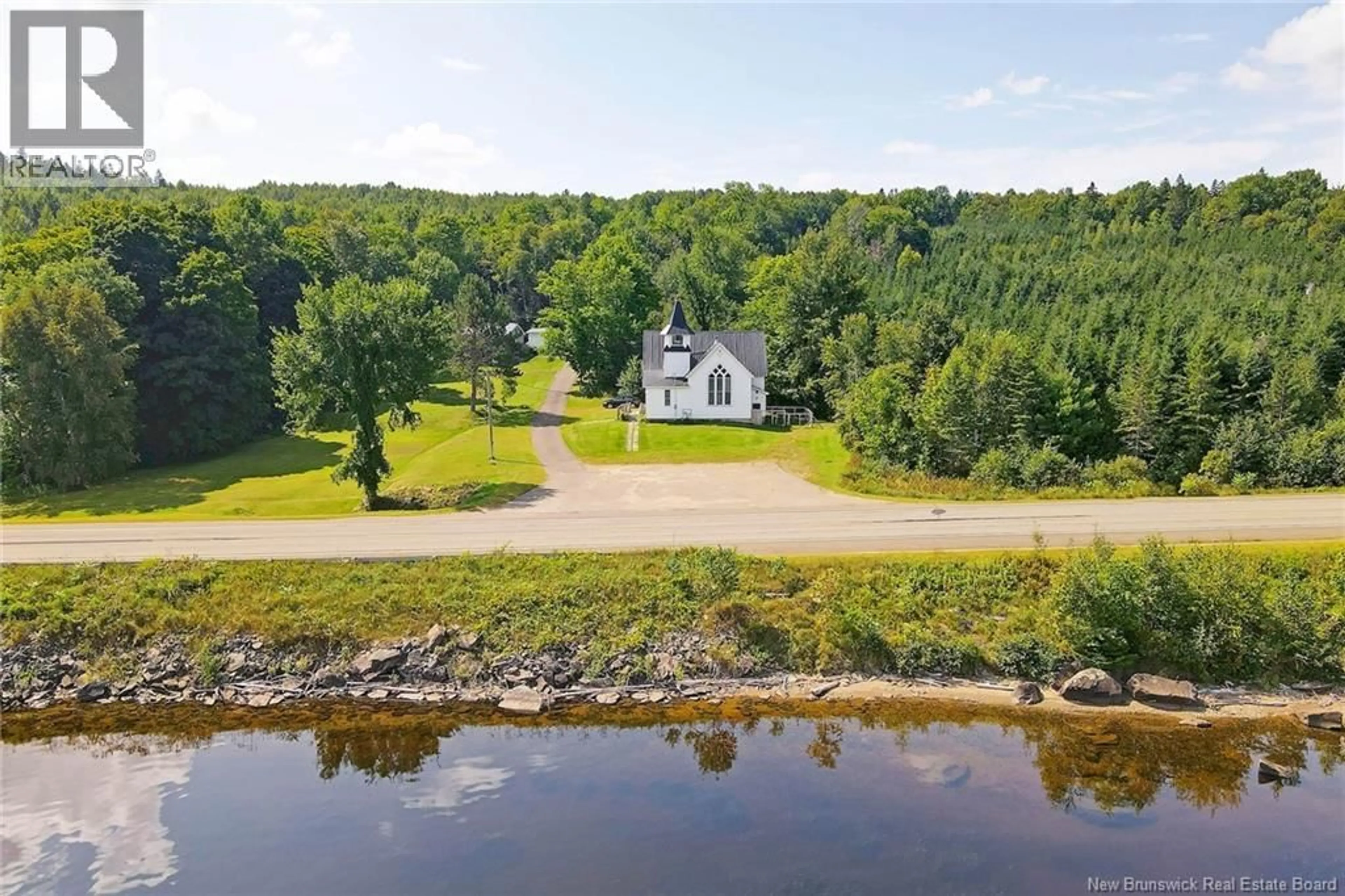 A pic from outside/outdoor area/front of a property/back of a property/a pic from drone, water/lake/river/ocean view for 6682 ROUTE 102, Prince William New Brunswick E6K3T7