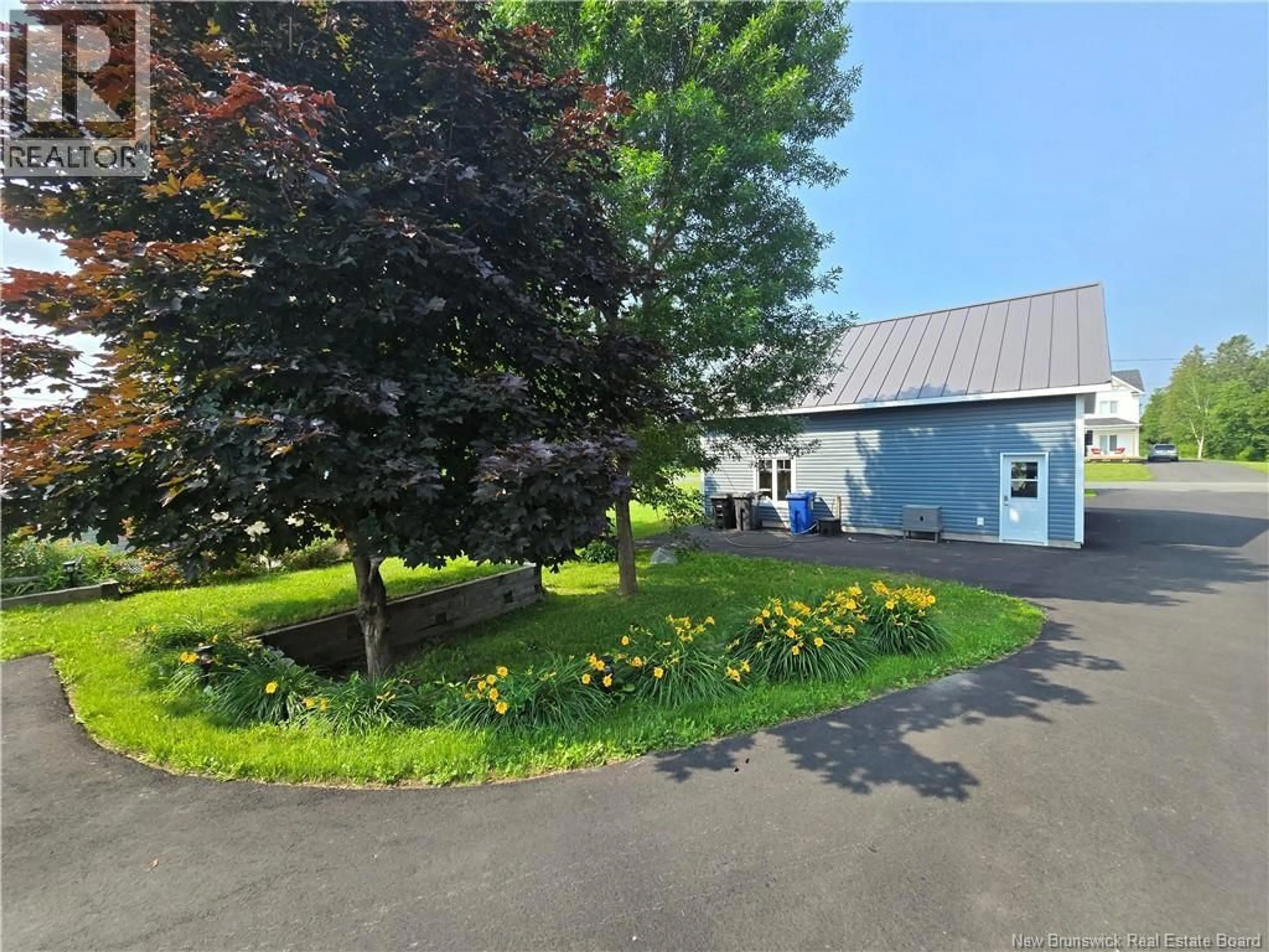A pic from outside/outdoor area/front of a property/back of a property/a pic from drone, unknown for 623 BAIE STREET, Beresford New Brunswick E8K1X3