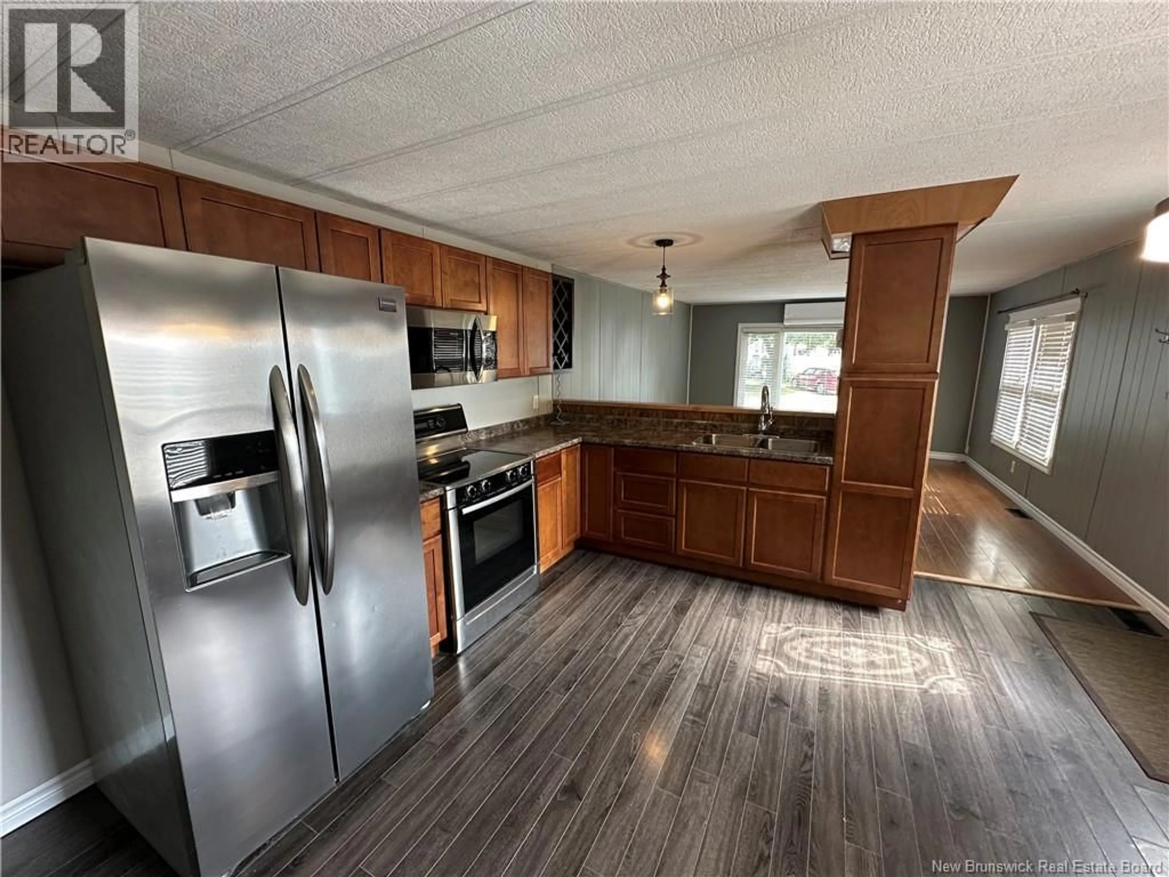 Open concept kitchen, wood/laminate floor for 349 CRAMMOND COURT, Miramichi New Brunswick E1V2B8