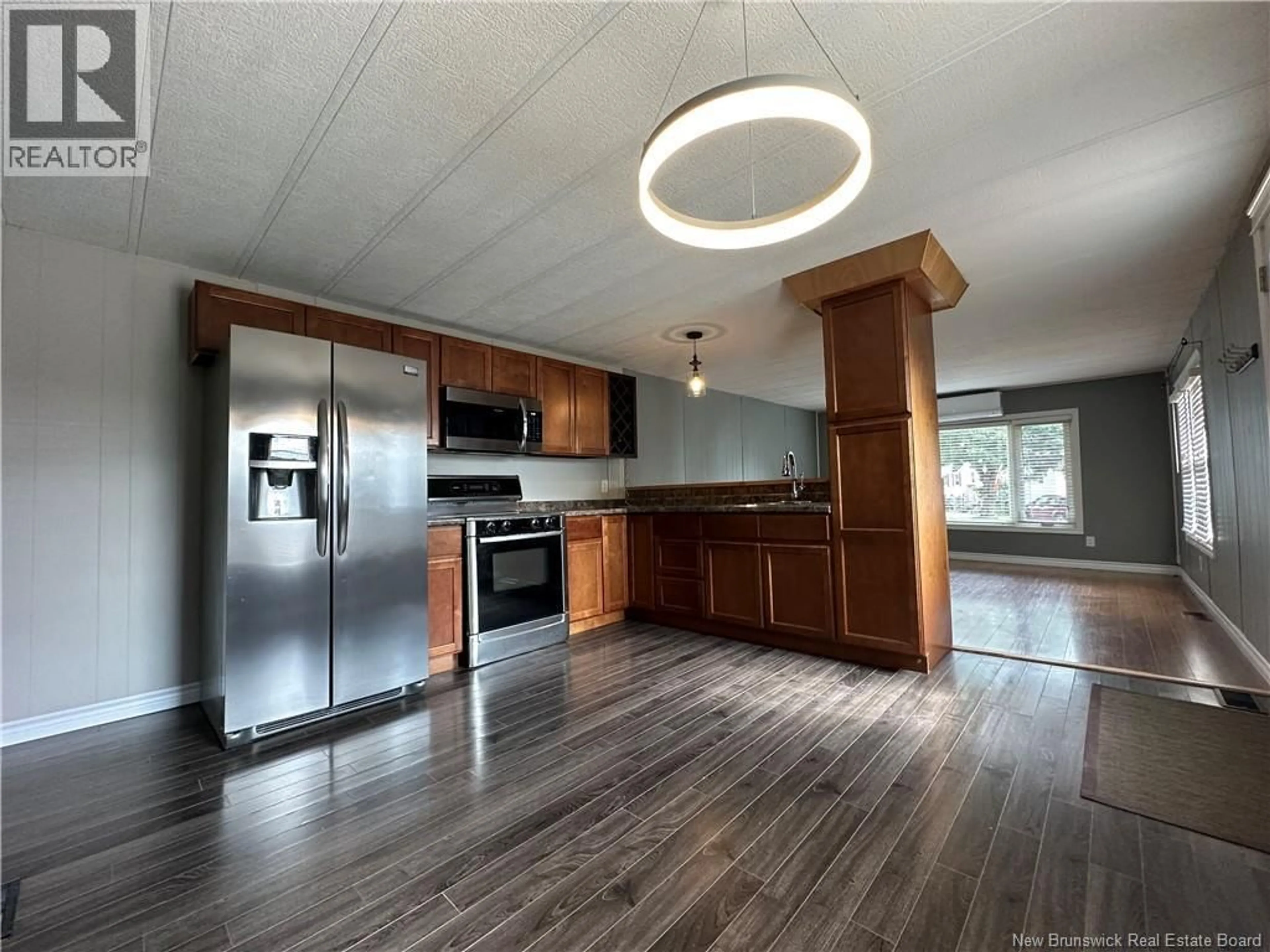 Open concept kitchen, wood/laminate floor for 349 CRAMMOND COURT, Miramichi New Brunswick E1V2B8