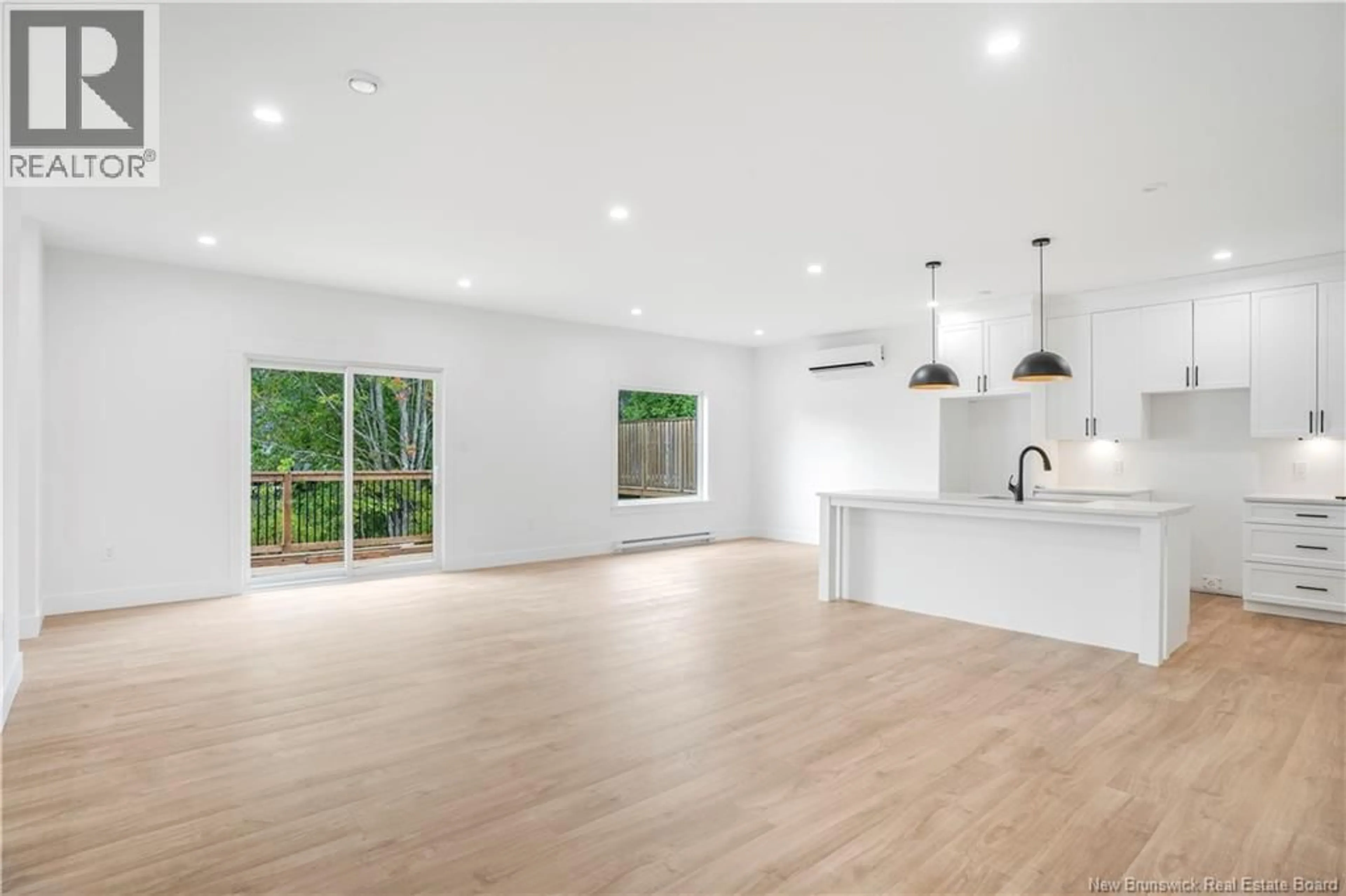 Open concept kitchen, wood/laminate floor for 8 SANDCHERRY LANE, New Maryland New Brunswick E3C0M4